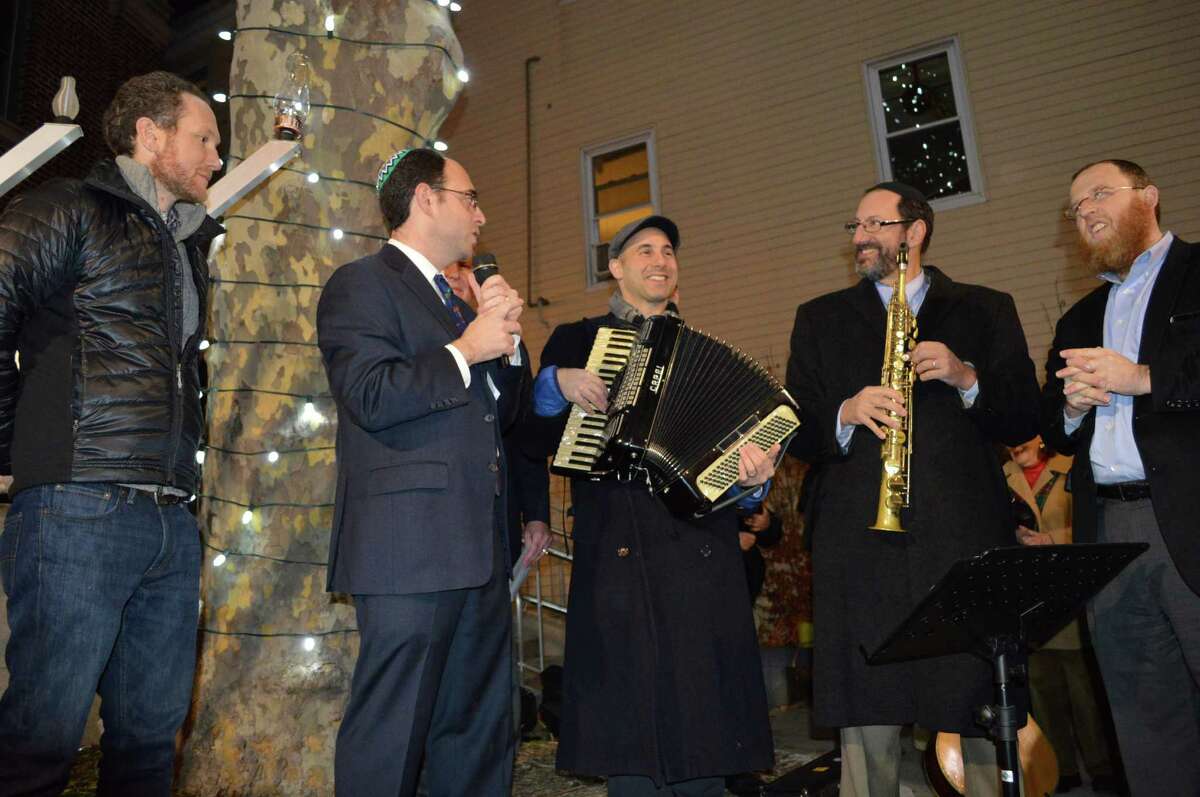 Leaders of the four Jewish congregations led the celebration of Hanukkah on Sunday evening -- from left, left Rabbi Michael Friedman, Rabbi Jeremy Wiederhorn, Cantor Dan Sklar, Rabbi Greg Wall and Rabbi Yehudah Leib Kantor.