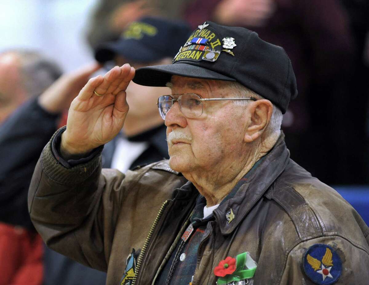 Alexander Sawchyn, 89, of Redding, a veteran of World War II, salutes during a Pearl Harbor Memorial service held at the War Memorial in Rogers Park Monday morning, Dec. 7, 2015.