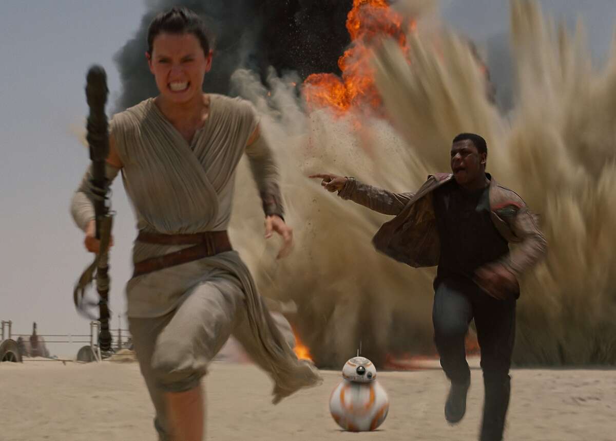 SWTFA Ridley Boyega starwars553530391ec3c RUN FOR YOUR LIFE Rey (Daisy Ridley, left) and Finn (John Boyega) run from a TIE fighter attack in "Star Wars: The Force Awakens," which you might have heard of. Everyone will have heard of these two young actors after the movie opens Dec. 18. Photo courtesy Walt Disney Studios and Lucasfilm. Star Wars: The Force Awakens..Ph: Film Frame..©Lucasfilm 2015