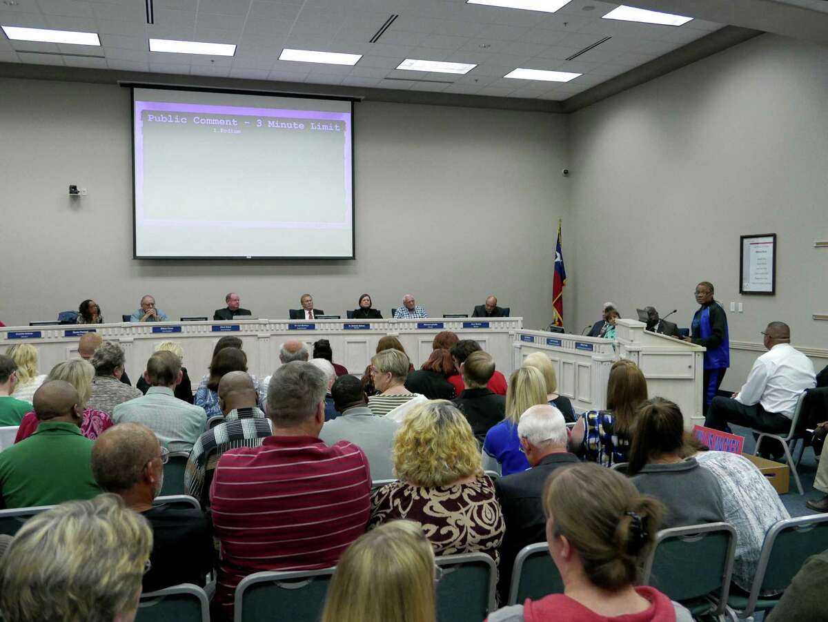 People listen during a special meeting called by the Judson ISD's board of trustees during which they discussed rescinding the naming of the district's new high school after former superintendent Willis Mackey on Wednesday, Dec. 9, 2015. The school will open next year. Mackey took a buyout and is still on the district's payroll.