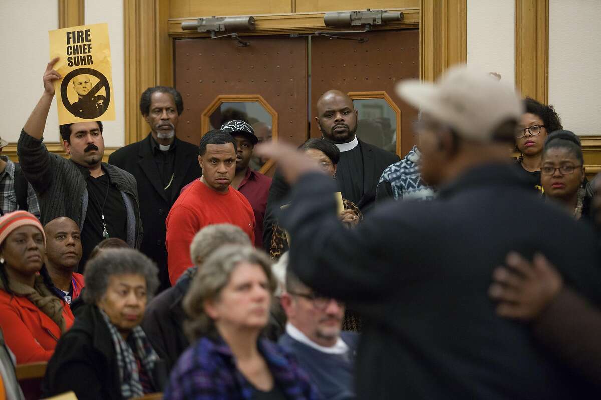 Audience members listen in during a public meeting at San Francisco City Hall, Wednesday, Dec. 9, 2015, in San Francisco, Calif. The S.F. Police Commission met inside City Hall and talked about the possibility of equipping police officers with Tasers following the fatal shooting of Mario Woods. It's a proposal that was turned down twice by the commission in recent years. Woods' case has brought the proposal back. Woods was shot and killed by police officers after police say Woods was armed with a knife and walked toward officers.