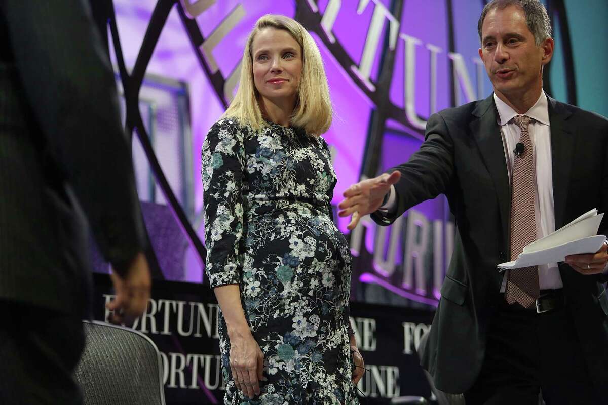 Yahoo CEO Marissa Mayer (middle) meets Salesforce CEO Marc Benioff at the Fortune Global Forum conference in November. Mayer gave birth to twin girls Thursday morning.