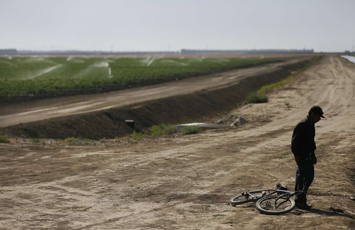 Martín Hernandez Mena, 50, prepares to take off his shoes before getting into an irrigation canal to cool off from the sweltering heat June 25, 2015, near the shantytown where he lives on a dried up canal bed on Westlands Water District land outside of Mendota, Calif. While it's too early to tell what the impact may be, La Niña, El Niño’s sister phenomenon, may bring drier conditions to California in the fall. Scroll through this slideshow to see signs that a game-changer El Niño is coming this winter.