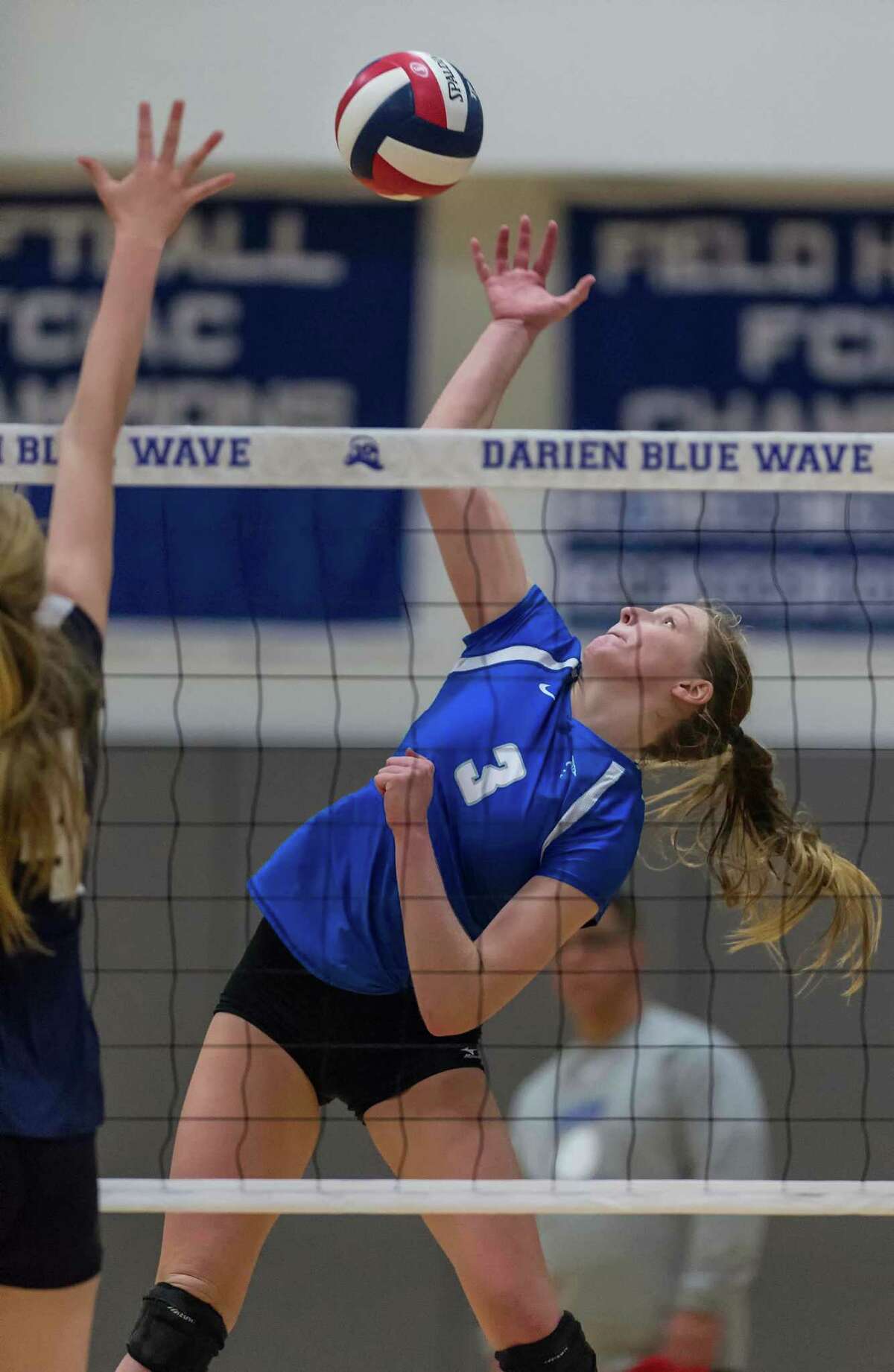 Darien High Schools Isabelle Taylor goes up to spike the ball during an FCIAC girls volleyball tournament match against Staples High School played at Darien High School, Darien, CT Tuesday, November 3, 2015.