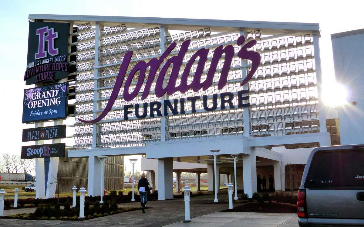 Zip lining above the furniture Jordan’s, owned by Warren Buffett, opens in New Haven