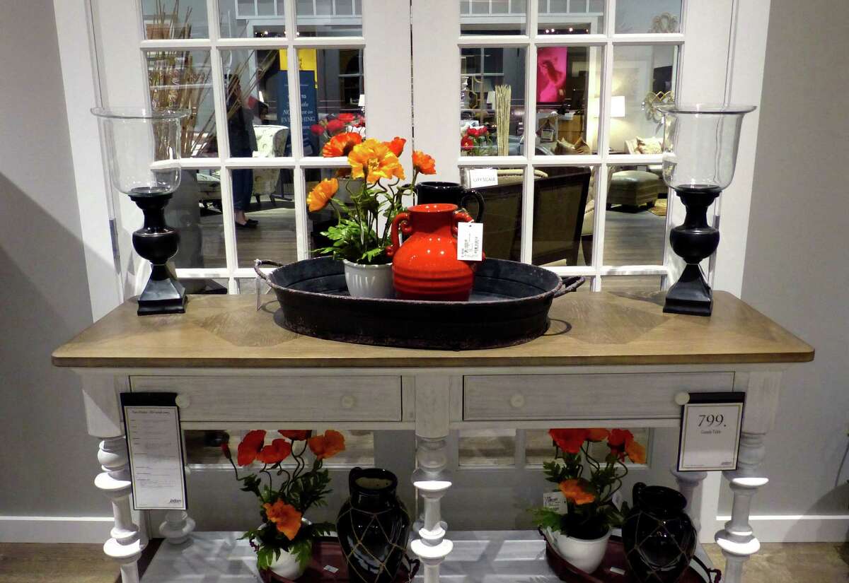 Zip lining above the furniture Jordan’s, owned by Warren Buffett, opens in New Haven