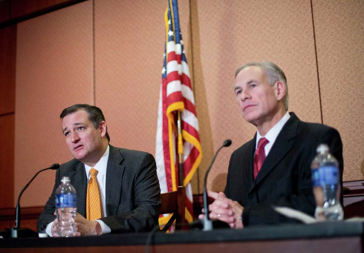 Republican presidential candidate Sen. Ted Cruz, R-Texas, left, and Texas Gov. Greg Abbott, right, speak about the resettlement of Syrian refugees in the U.S., during their joint news conference on Capitol Hill in Washington, Tuesday, Dec. 8, 2015. (AP Photo/Pablo Martinez Monsivais)