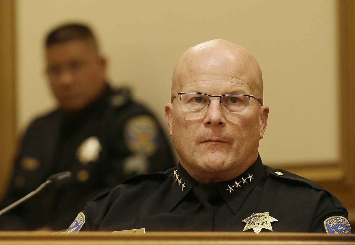 San Francisco Police Chief Greg Suhr, right, listens to public speakers during a meeting of San Francisco's Police Commission in San Francisco, Wednesday, Dec. 9, 2015.