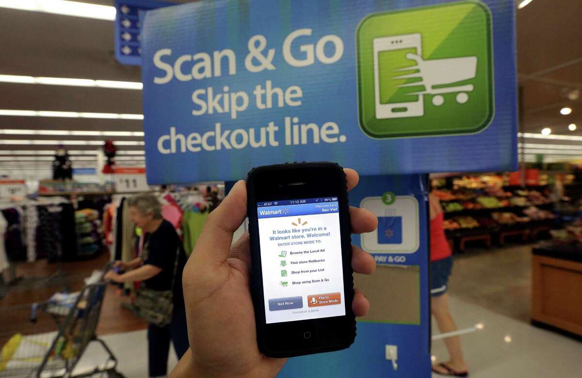 In 2013, a Wal-Mart representative demonstrated a Scan & Go mobile application on a smartphone at a store in San Jose, Calif. Wal-Mart is now trying to develop its own electronic pay system and is still part of another project involving other retailers.