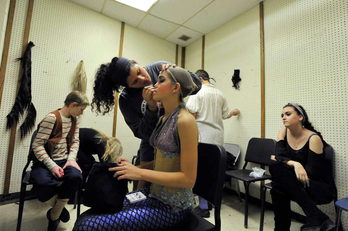 OPENING NIGHT Monica Gonzalez applies the finishing touches on Audrey Molina's makeup before the opening night performance of the All-School Musical “The Little Mermaid.” The show continues this weekend. For information, visit stamfordallschoolmusical.org