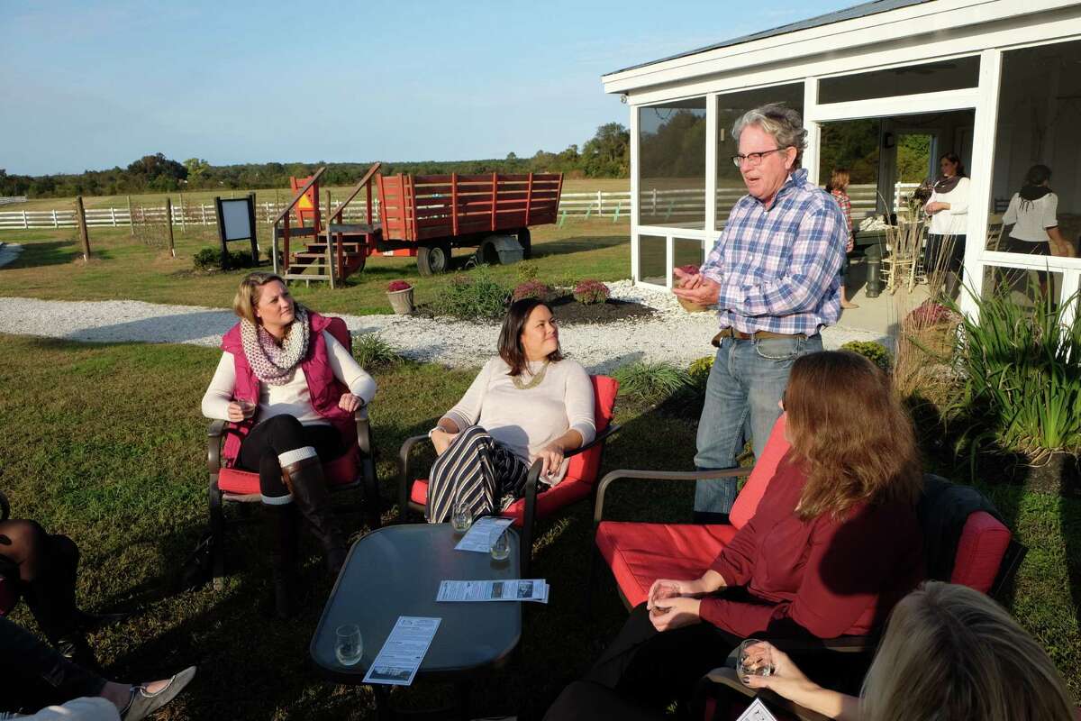 Dudley Patteson of Dog and Oyster Vineyard holds court with a group of female visitors.
