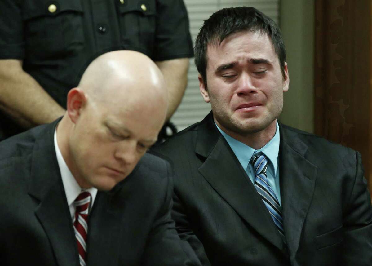 Daniel Holtzclaw, right, cries as the verdicts are read in his trial in Oklahoma City, Thursday, Dec. 10, 2015. At left is defense attorney Robert Gray. Holtzclaw, a former Oklahoma City police officer, was facing dozens of charges alleging he sexually assaulted 13 women while on duty. Holtzclaw was found guilty on a number of counts. (AP Photo/Sue Ogrocki, Pool)