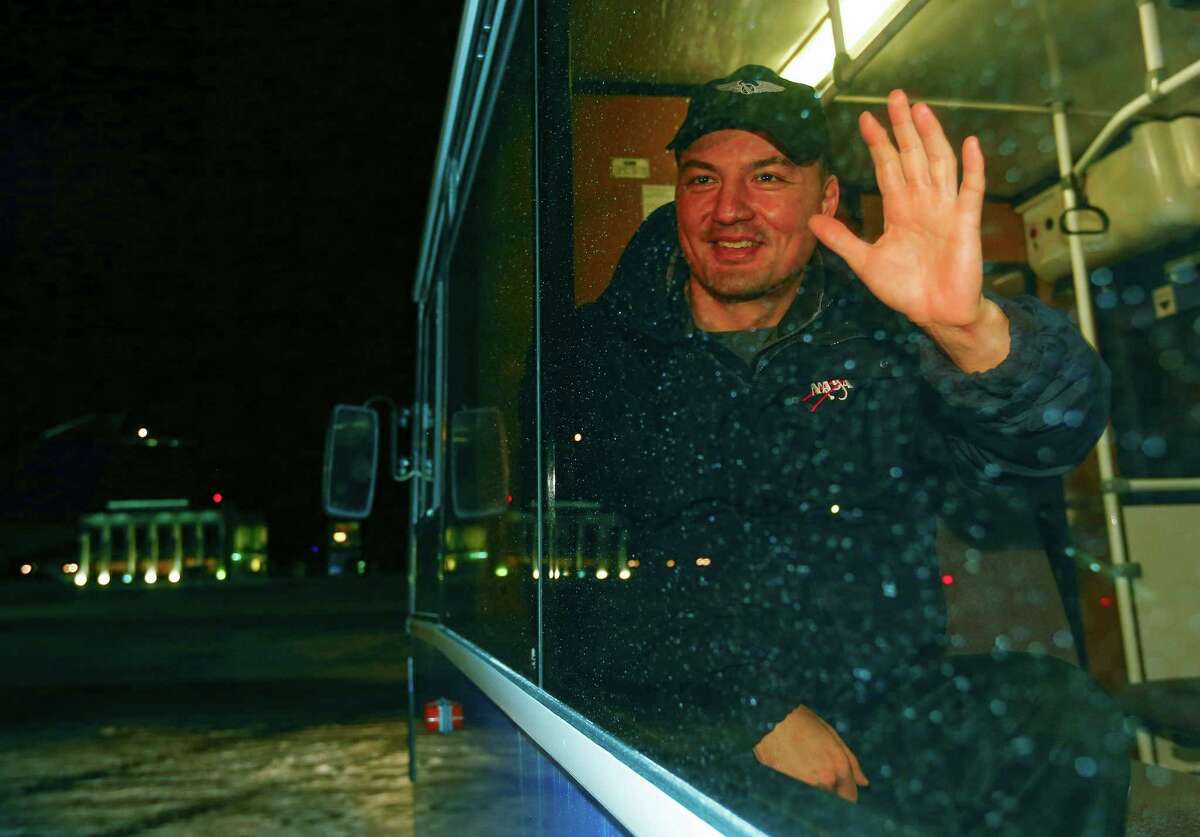 International Space Station crew member U.S. space agency's Kjell Lindgren waves from a bus on arrival from the landing site to Dzhezkazgan, Kazakhstan, Friday, Dec. 11, 2015.Â A three-person crew, U.S. space agency's Kjell Lindgren, Russia's Oleg Kononenko and Kimiya Yui of Japan, from the International Space Station landed safely Friday in the snowy steppes of Kazakhstan. (Shamil Zhumatov/Pool Photo via AP)