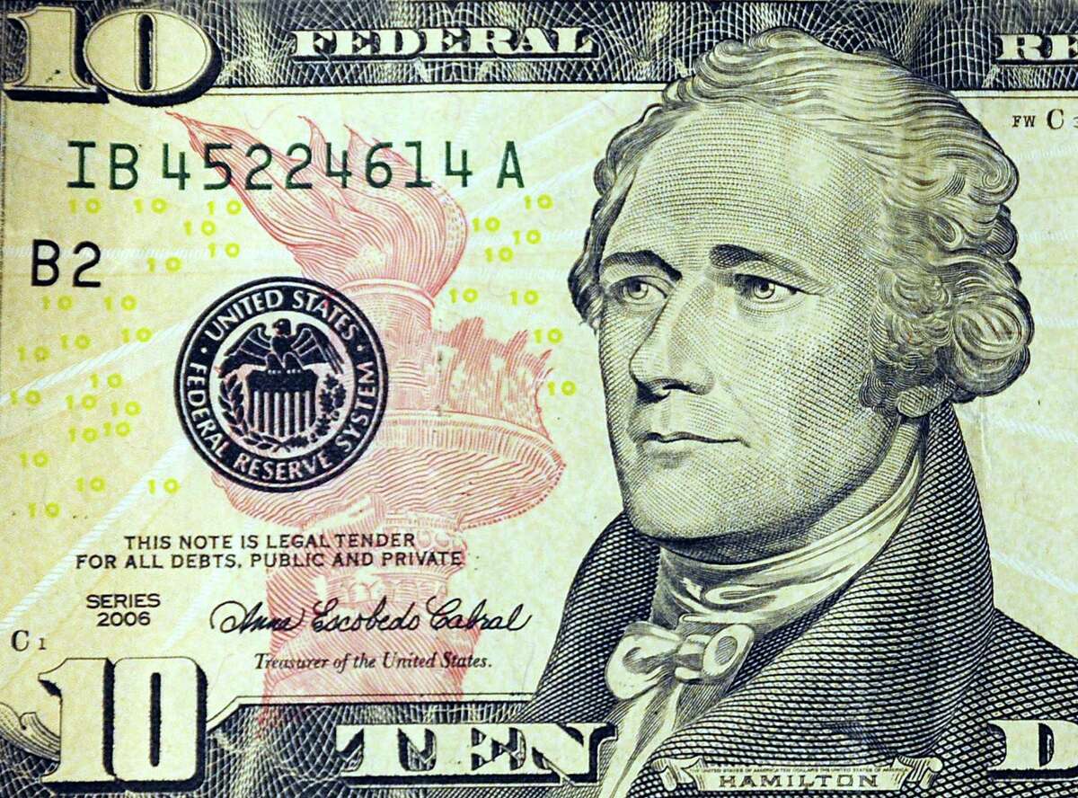 (FILES): This March 29, 2009 file illustration shows Alexander Hamilton, the first US Secretary of the Treasury, on the front of the USD10 note in Washington, DC. US Treasury Secretary Jacob J. Lew announced June 17, 2015 that a newly redesigned USD10 note will replace the image of Hamilton and feature a woman. In exercising his responsibility to select currency features and design, Treasury Secretary Lew will select a notable woman with a focus on celebrating a champion for America's inclusive democracy. The Treasury Department, with the Bureau of Engraving and Printing (BEP), expects to unveil the new USD10 note in 2020, the 100th anniversary of the passage of the 19th Amendment, which gave women the right to vote. Historically, the Secretary has relied on the Bureau of Engraving and Printing to provide advice on themes, symbols and concepts to be used on currency. However, for the newly redesigned note, the Secretary is seeking input from the public about what qualities best represent democracy to help guide the design process for the next generation of notes. AFP PHOTO / Files / Karen BLEIERKAREN BLEIER/AFP/Getty Images