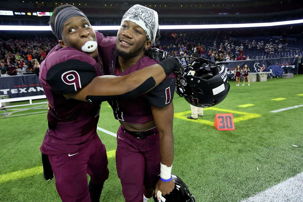 George Ranch's Alex Fontenot heads toward the end zone for a touchdown in the first half Friday night, when the Longhorns beat Vista Ridge 42-23, leading Nikial Onu (9) and Darius Anderson to a celebratory embrace on their way to the Class 5A Division I final.