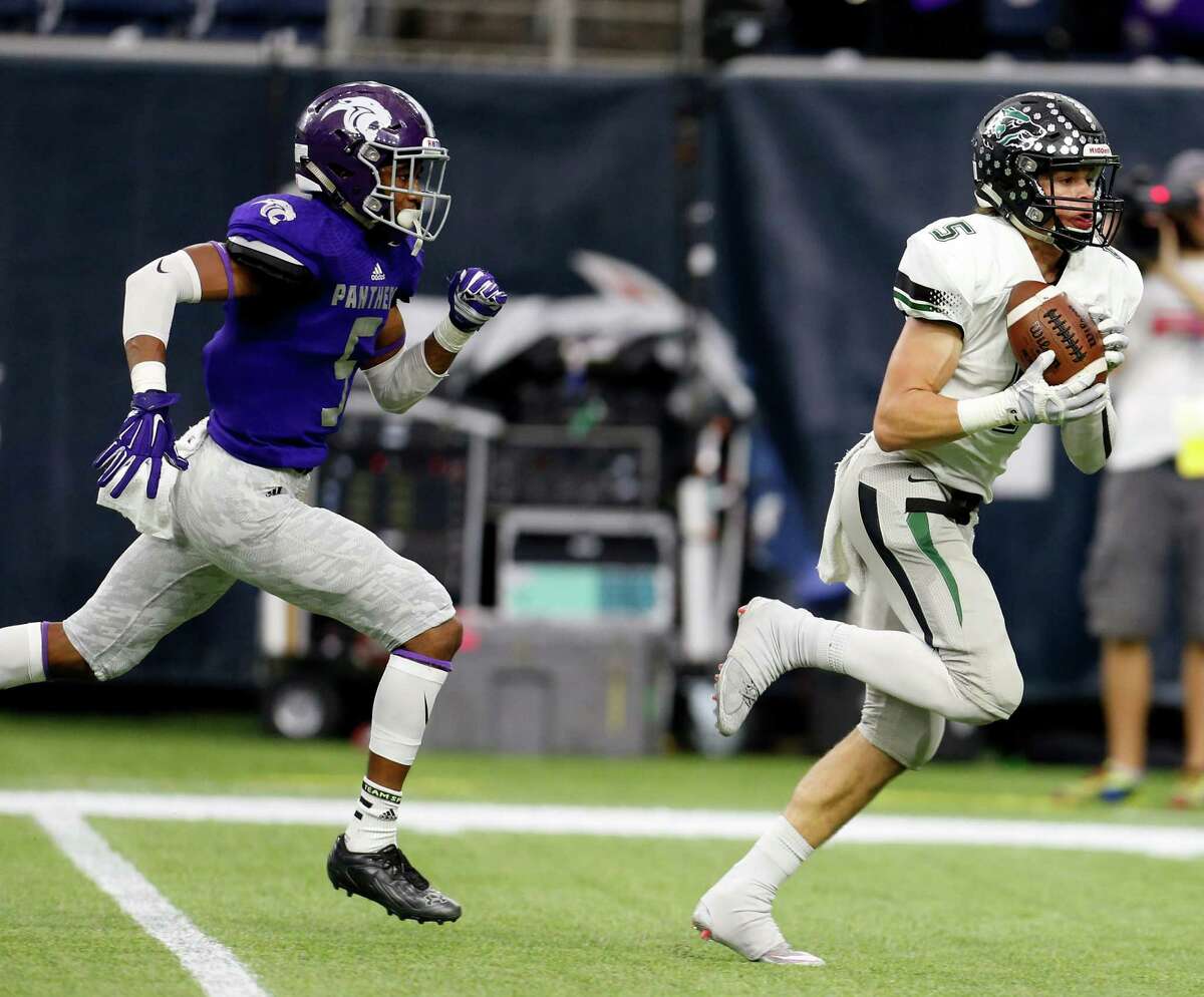 Cedar Park's Tommy Lavine, right, beats Ridge Point's Ar'mani Johnson on a catch-and-run for a 47-yard touchdown in the second quarter of Saturday's game.