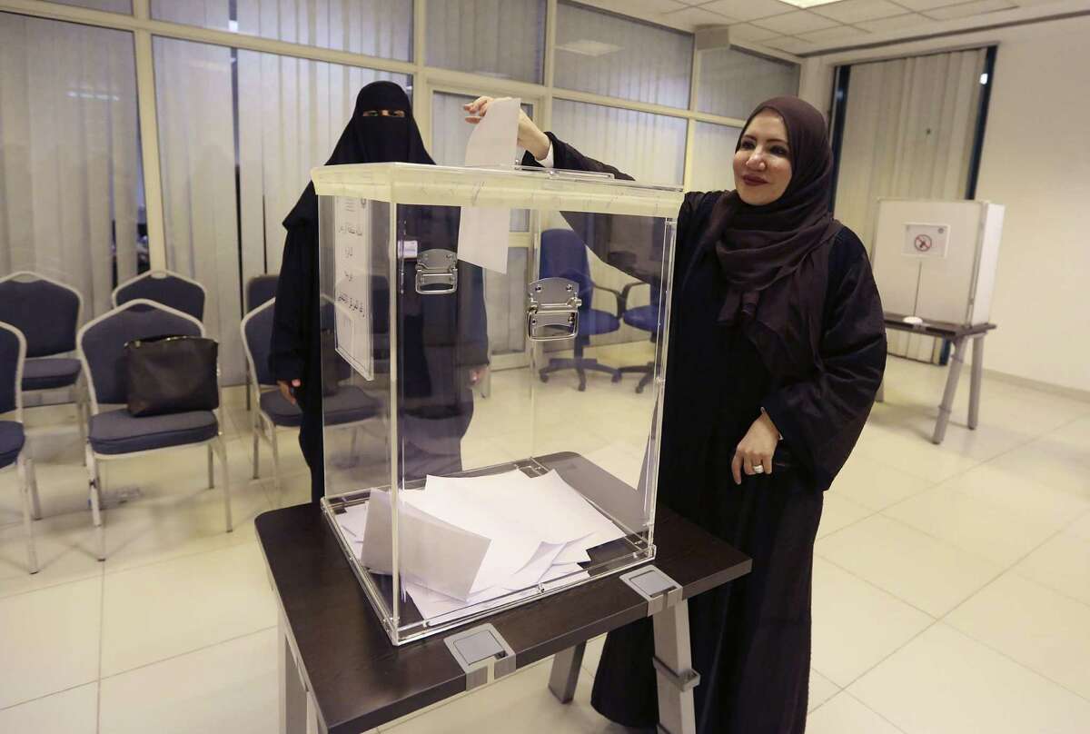 ﻿The late King Abdullah granted women the right to vote and run for office before his death, a right exercised for the first time Saturday in elections for local council seats. However, men and women cast ballots at separate polling stations, and female candidates could not directly address male voters.