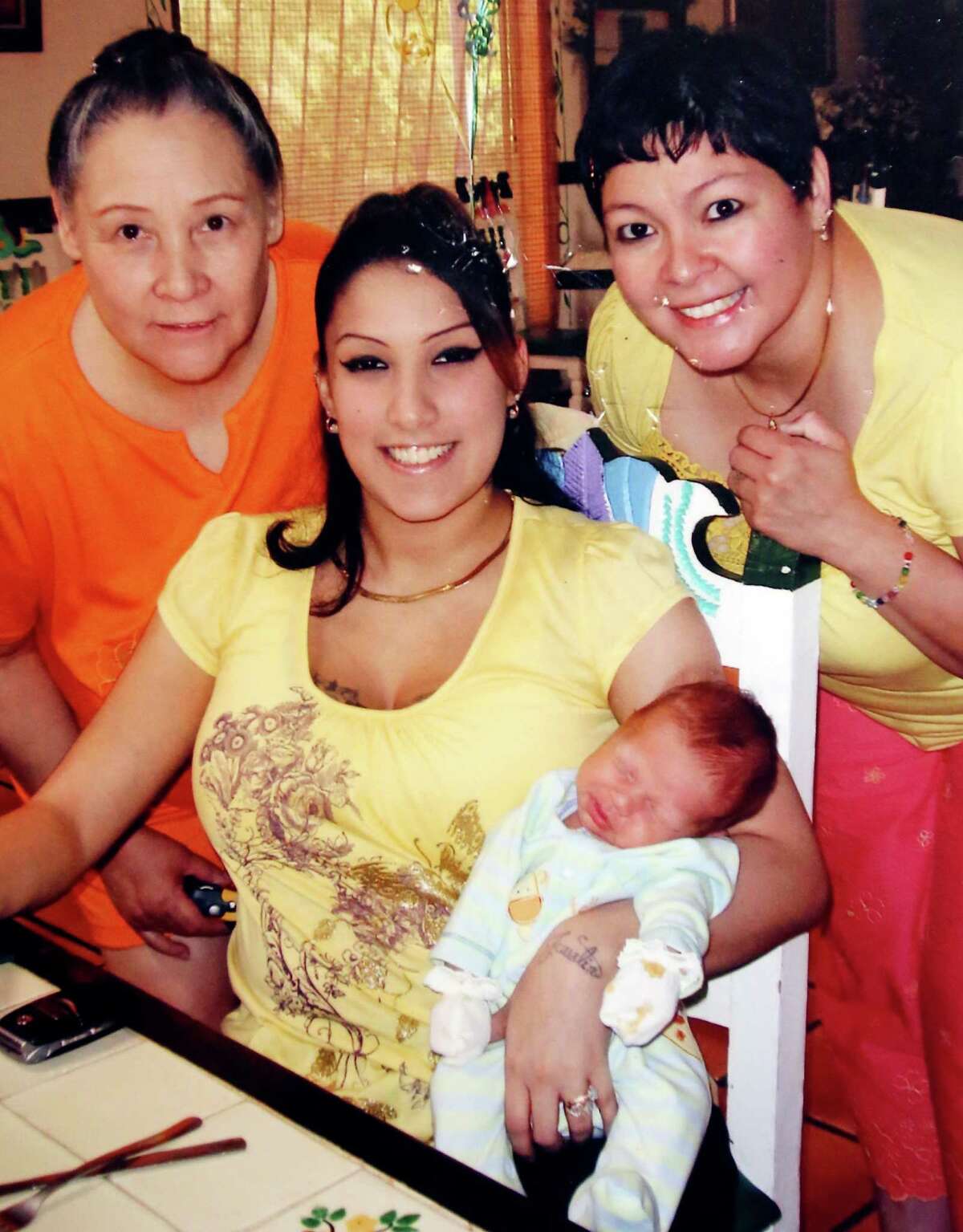 In a family photo, Mandi Garza is shown holding her son, Noah Garza, when he was an infant. Beside her is her mother Jean Limon (left) and sister Rita Barrientos. Mandi Garza was killed in July 2014 in a crash caused by a drunken driver.
