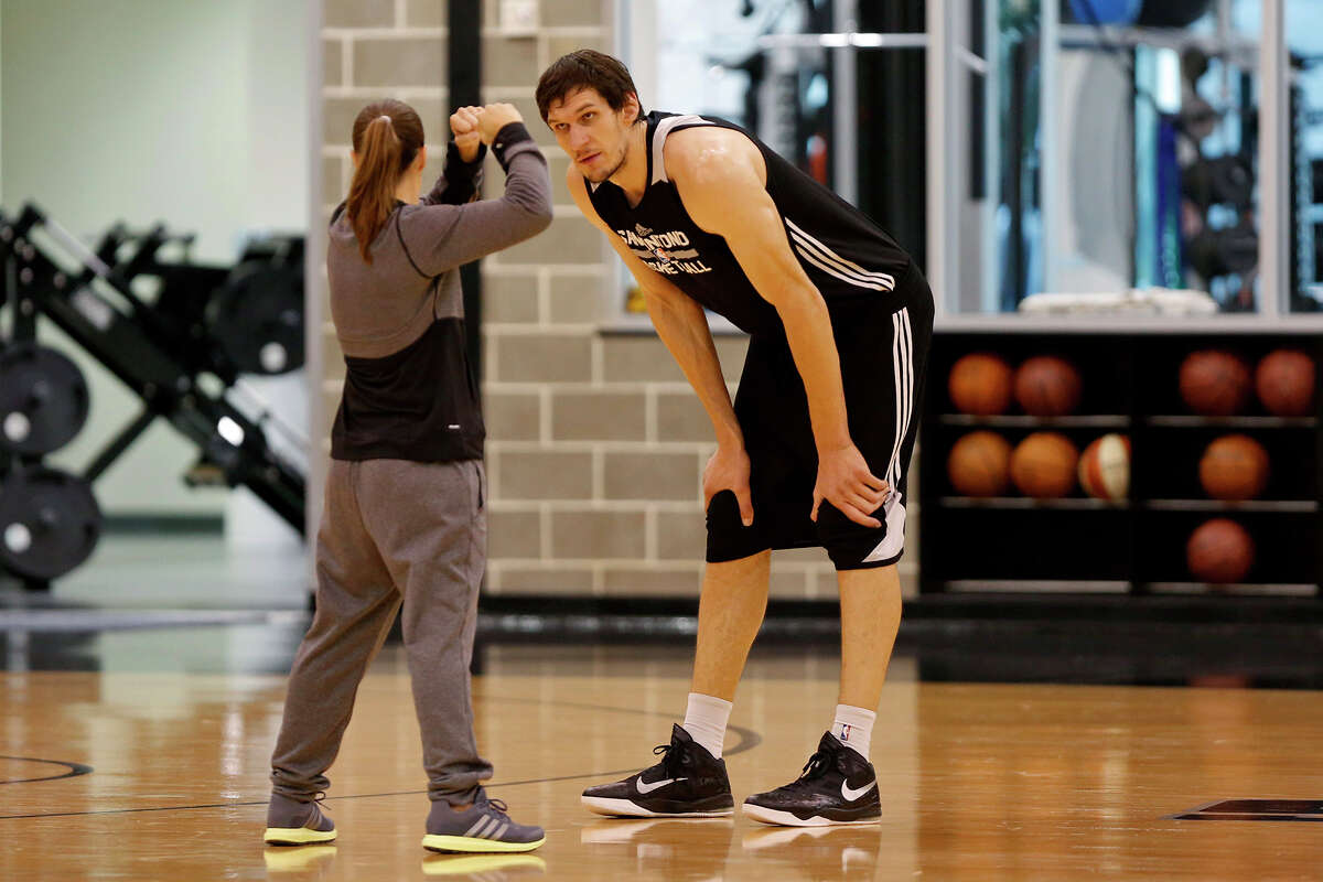 Spurs assistant coach Becky Hammon works with Boban Marjanovic at the Spurs practice facility on Nov. 25, 2015.