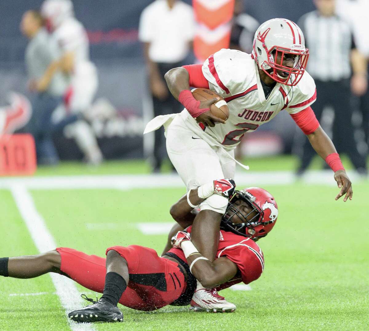 North Shore's Jaylen Thomas hangs on to sack Converse Judson's Julon Williams in the second half of Saturday's game at NRG Stadium.