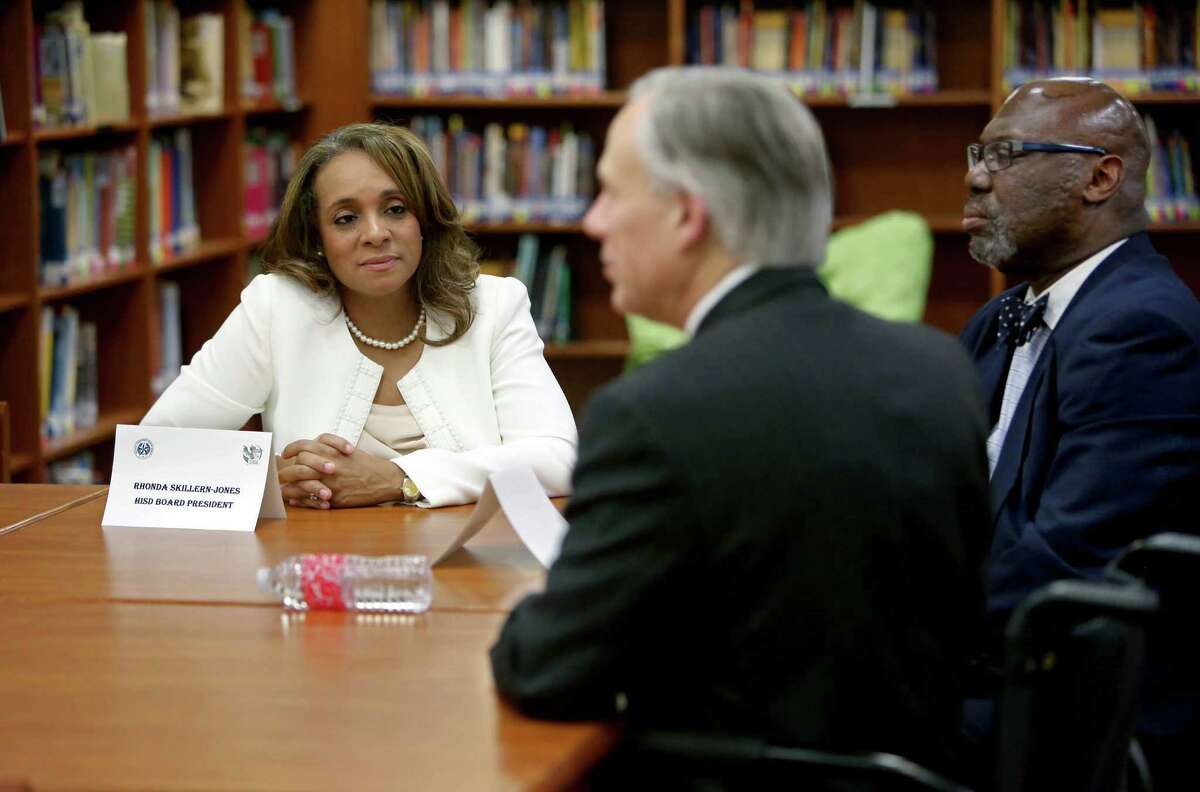 Rhonda Skillern-Jones, left, HISD Board President, along with other school officials, meet with Governor Greg Abbott, center, and Michael L. Williams, Texas commissioner of education at the School at St. George Place Thursday, Feb. 26, 2015, in Houston, Texas. Governor Abbott visited Houston to speak to Pre-K classes as part of his State of the State Tour. ( Gary Coronado / Houston Chronicle )