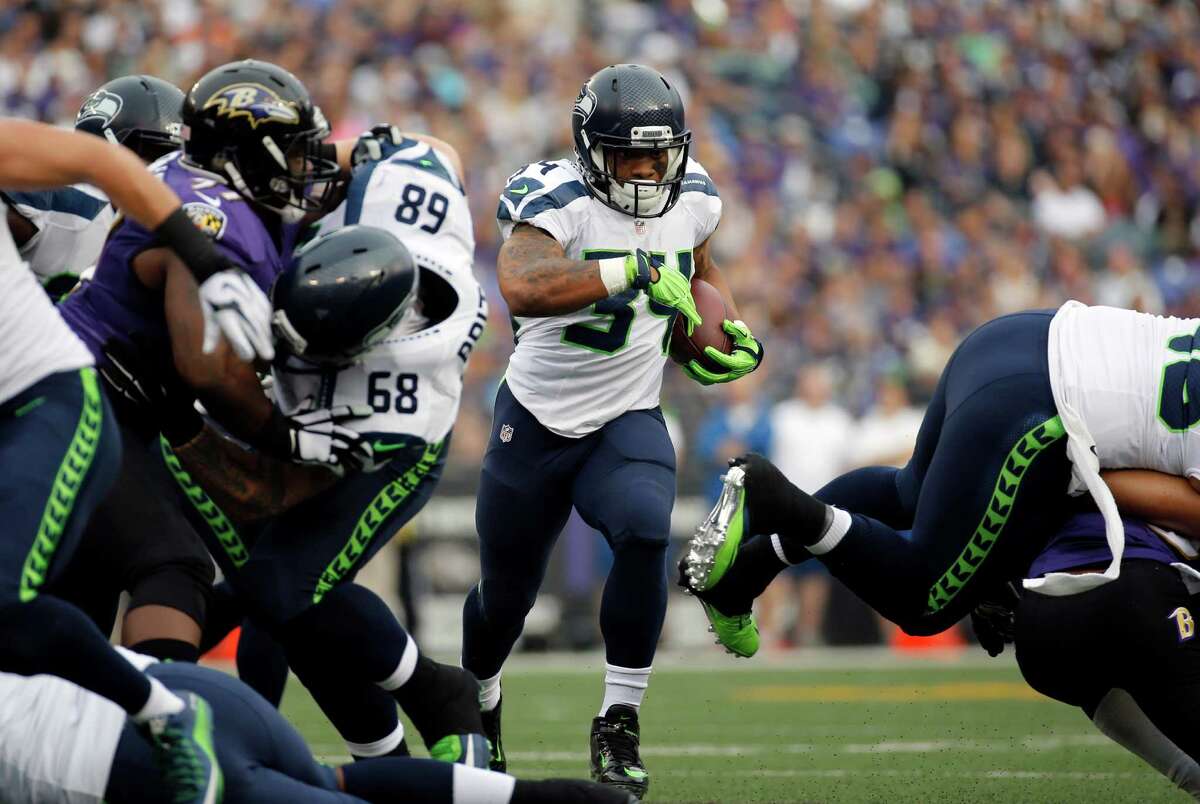 Seattle Seahawks running back Thomas Rawls (34) runs during the first half an NFL football game against the Baltimore Ravens, Sunday, Dec. 13, 2015, in Baltimore. (AP Photo/Patrick Semansky)