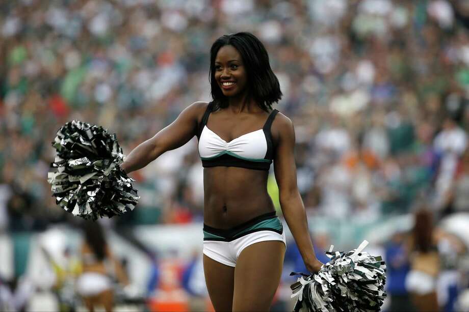 A Philadelphia Eagles' cheerleader performs during the first half of a...