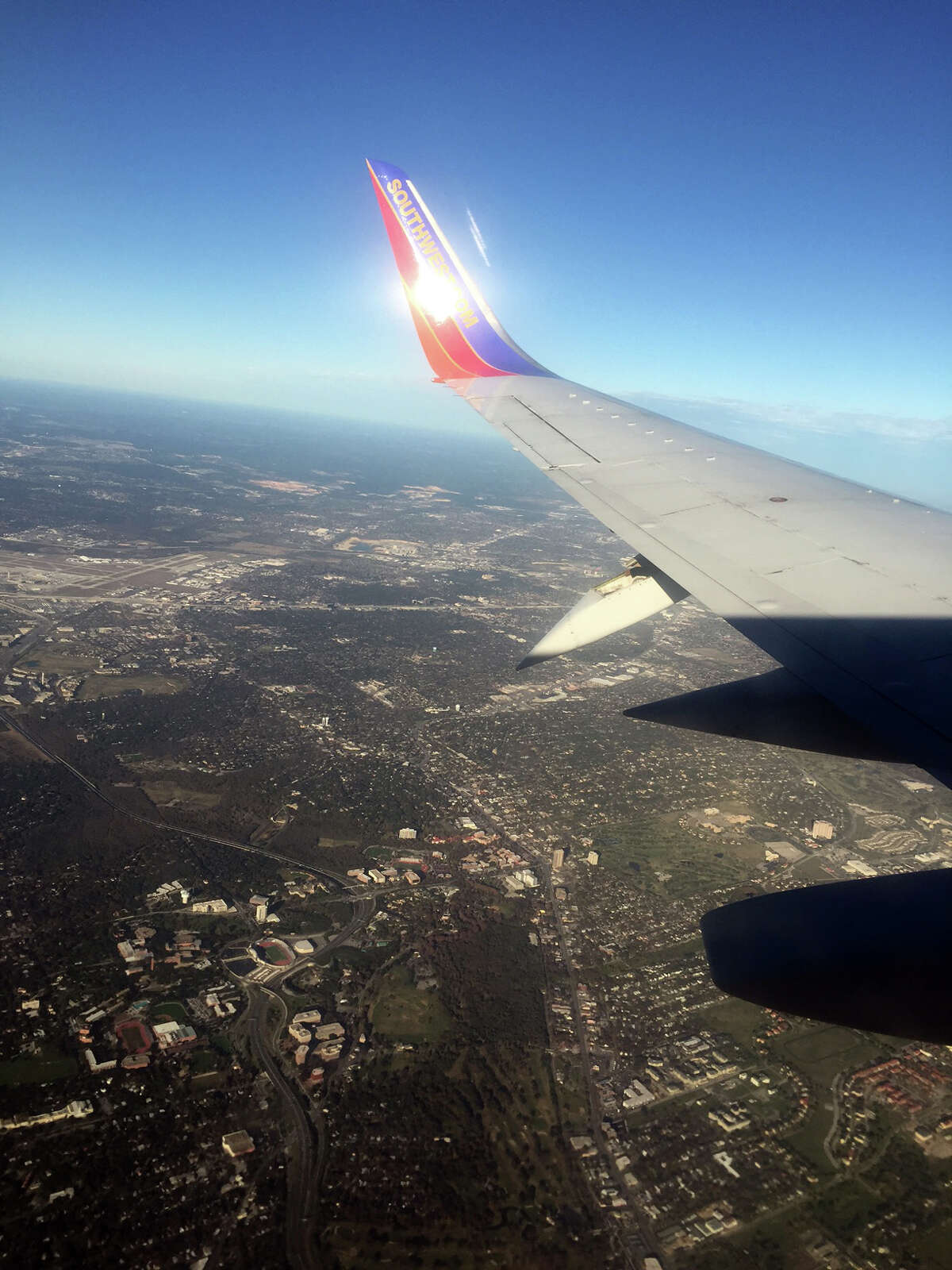 A passenger's photo of the damaged wing of a Southwest Airlines flight heading into San Antonio International Airport on Sunday, Dec. 13, 2015.