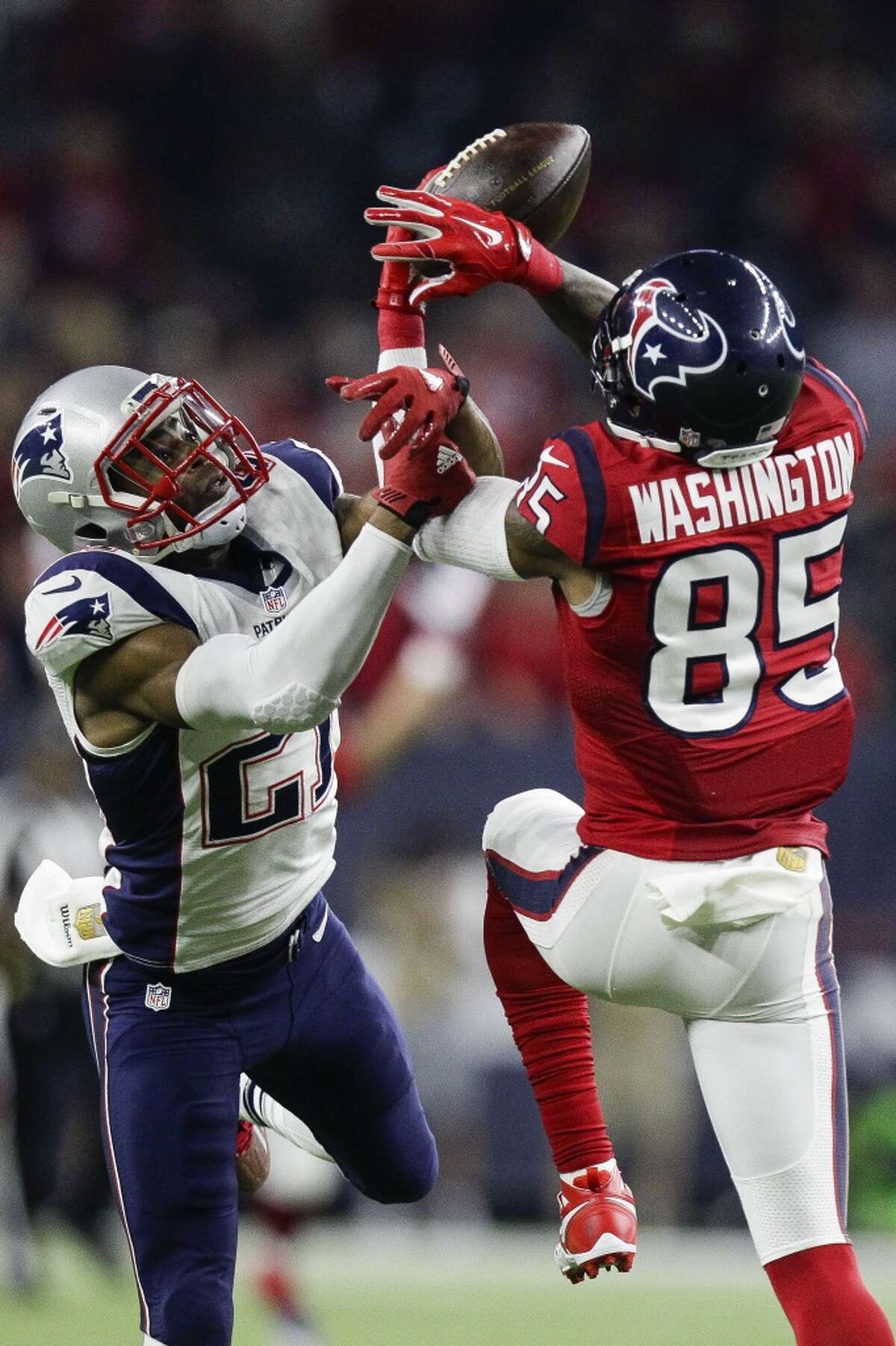Houston Texans wide receiver Nate Washington (85) misses a pass while being defended by New England Patriots cornerback Malcolm Butler (21) during the second half an NFL game at NRG Stadium Sunday, Dec. 13, 2015, in Houston. ( Michael Ciaglo / Houston Chronicle )
