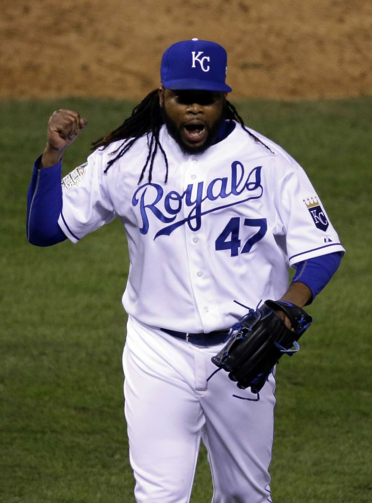 Kansas City Royals pitcher Johnny Cueto celebrates the end of the top of the eighth inning of Game 2 of the Major League Baseball World Series against the New York Mets Wednesday, Oct. 28, 2015, in Kansas City.
