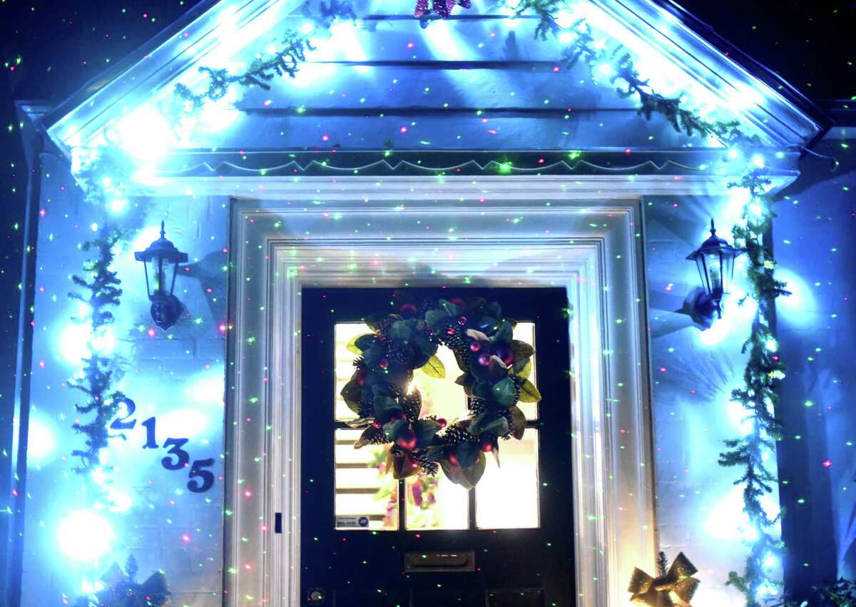A wreath and Christmas lights great visitors to the Modern Southern-style house in Monticello Park owned by Jeffery James and his partner Justin Michaelson.