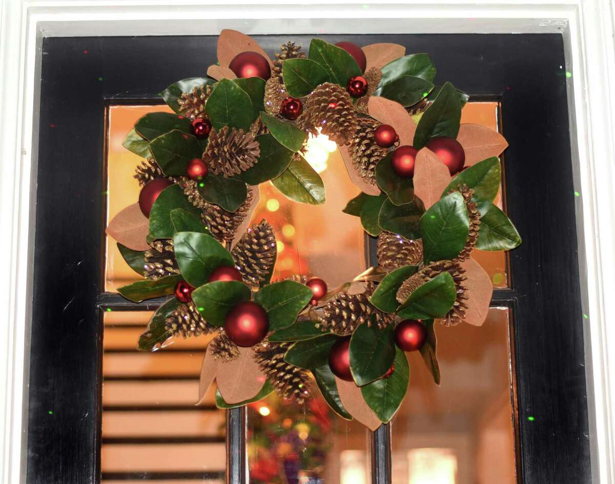 A wreath and Christmas lights great visitors to the Modern Southern-style house in Monticello Park owned by Jeffery James and his partner Justin Michaelson.