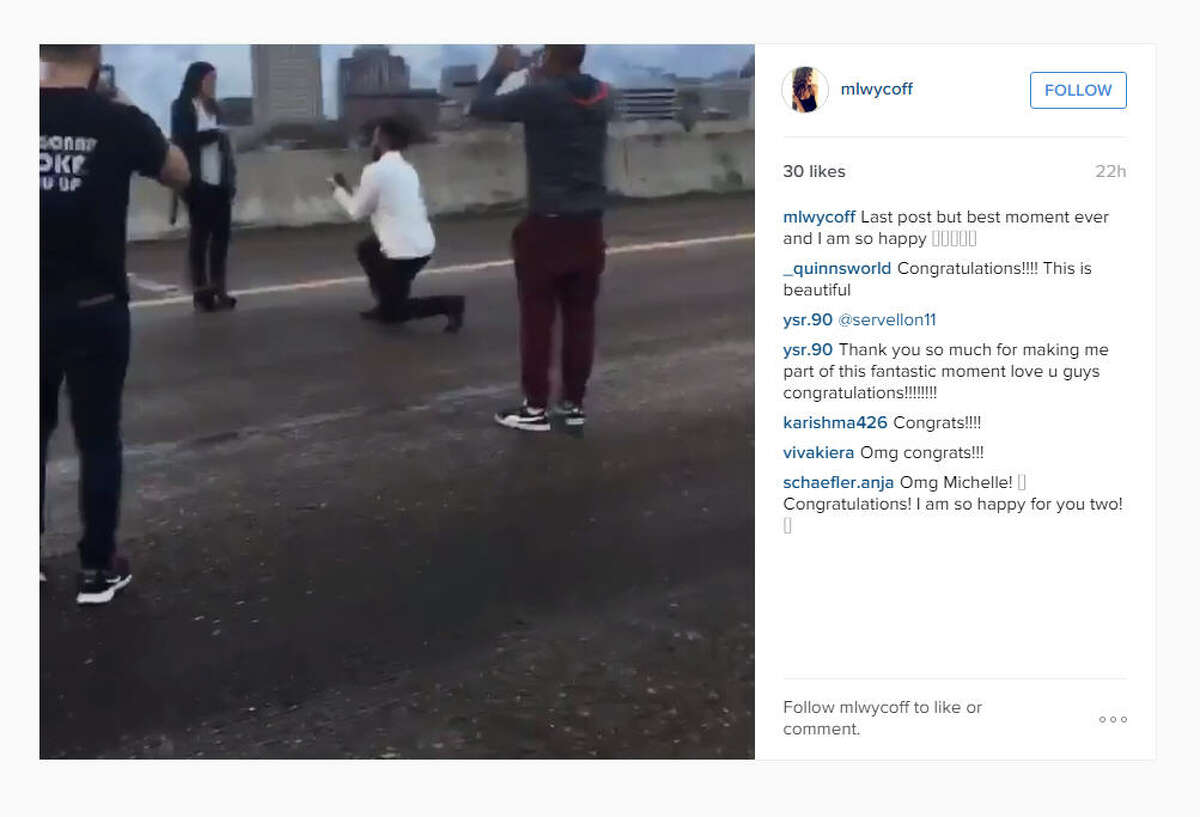 A video posted on Instagram on Sunday, Dec. 14, 2015, showed a man proposing to a woman on Interstate 45 near downtown Houston while others blocked traffic. (mlwycoff on Instagram)