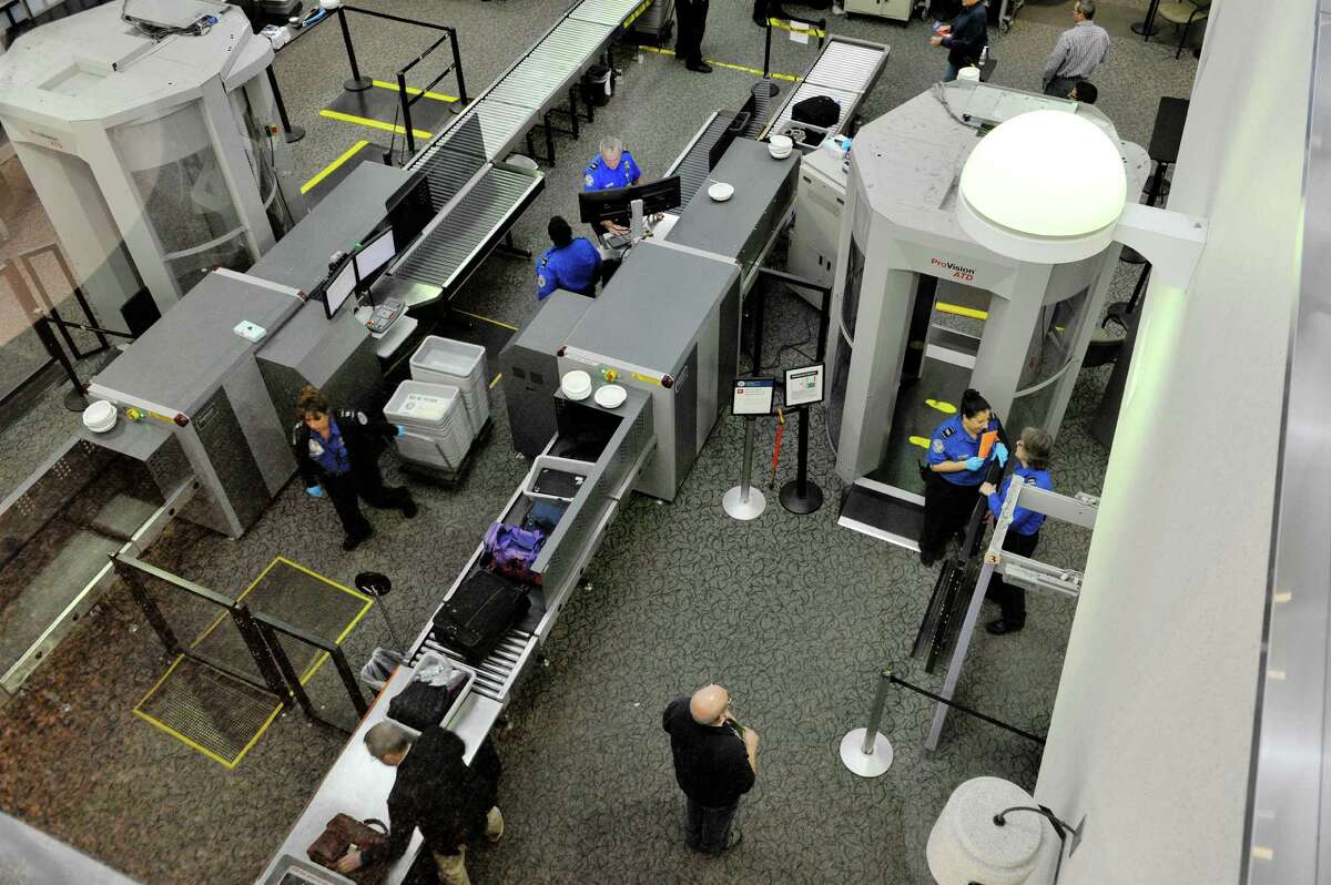 Travelers make their way through the security checkpoint at the Albany International Airport on Tuesday, Dec. 15, 2015, in Colonie, N.Y. (Paul Buckowski / Times Union)