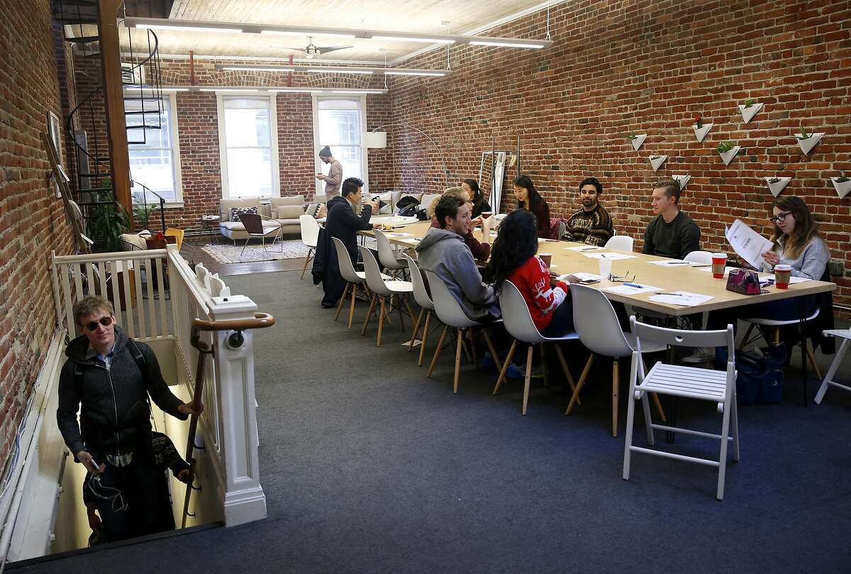 Udemy employees attend a team building presentation at a Breather shared meeting space on Mission Street in San Francisco, Calif. on Tuesday, Dec. 15, 2015.