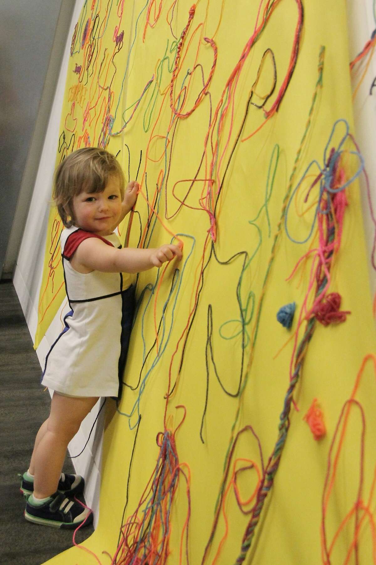 Little girl working with Wikki Stix at the Contemporary Jewish Museum.