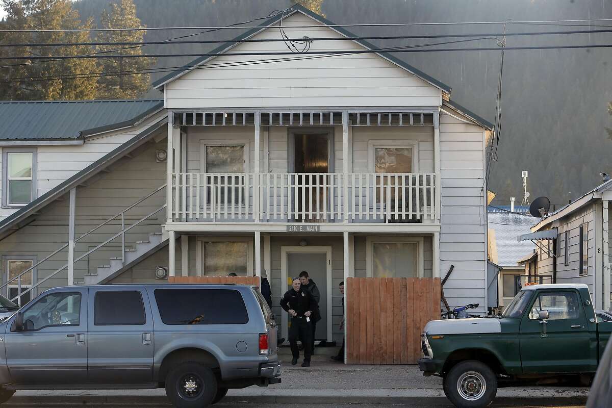 Police personnel gather outside the home of the two suspects located in Quincy, Calif., on Tuesday December 15, 2015. Suspects Gonzalo Curiel and Tami Joy Huntsman are facing charges in the death of two young children ages five and seven found dead inside a storage locker in Redding.