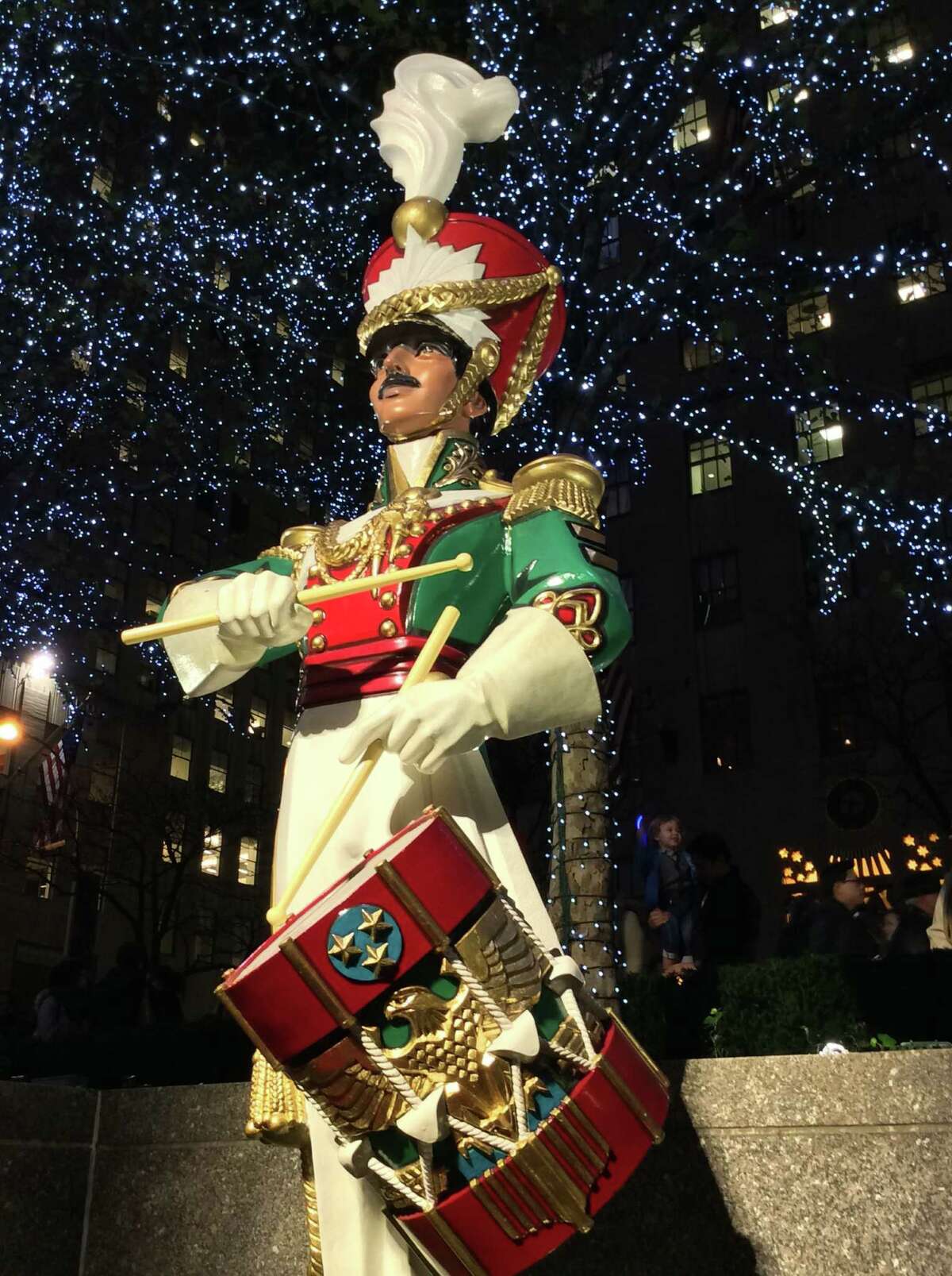 A drummer boy is spotted near the Rockefeller Center ice rink.