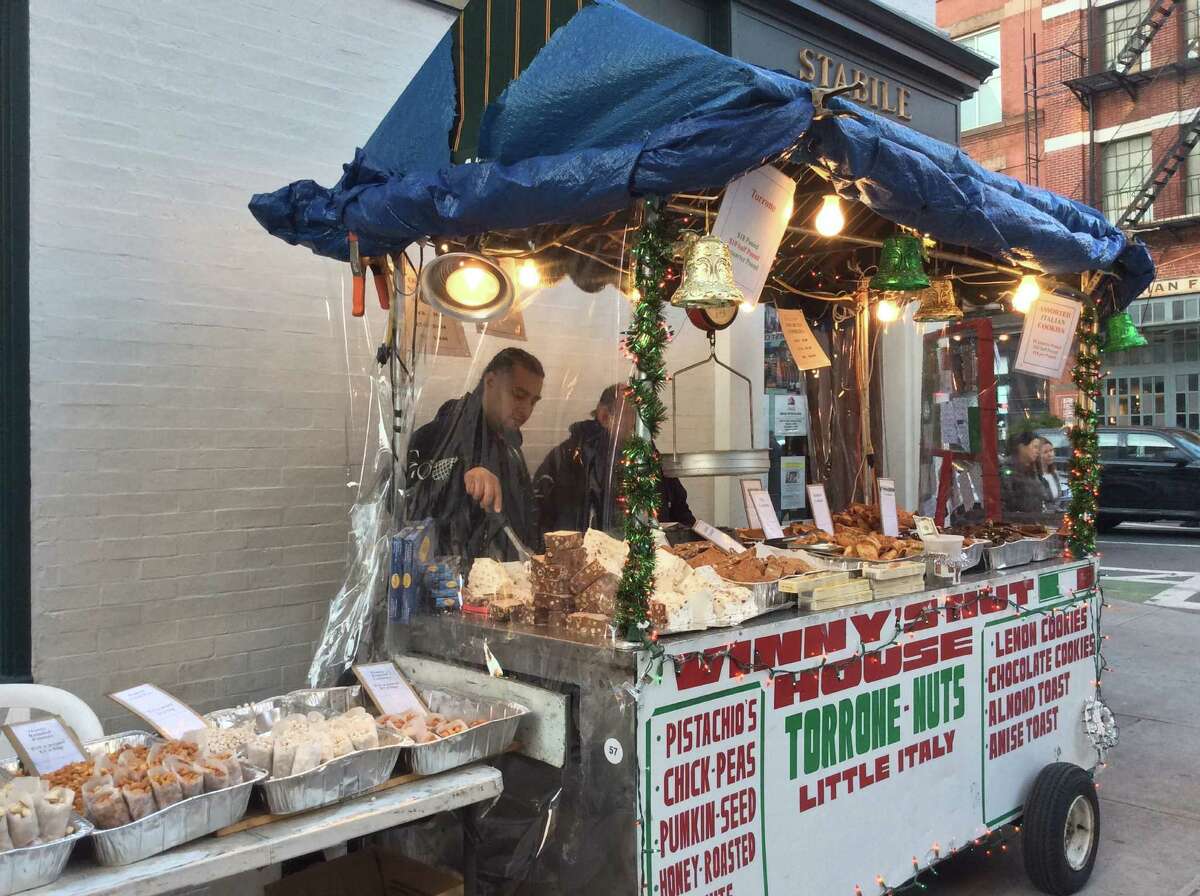 Vinny’s Nut House in Little Italy sells a variety of specialty items on the street.