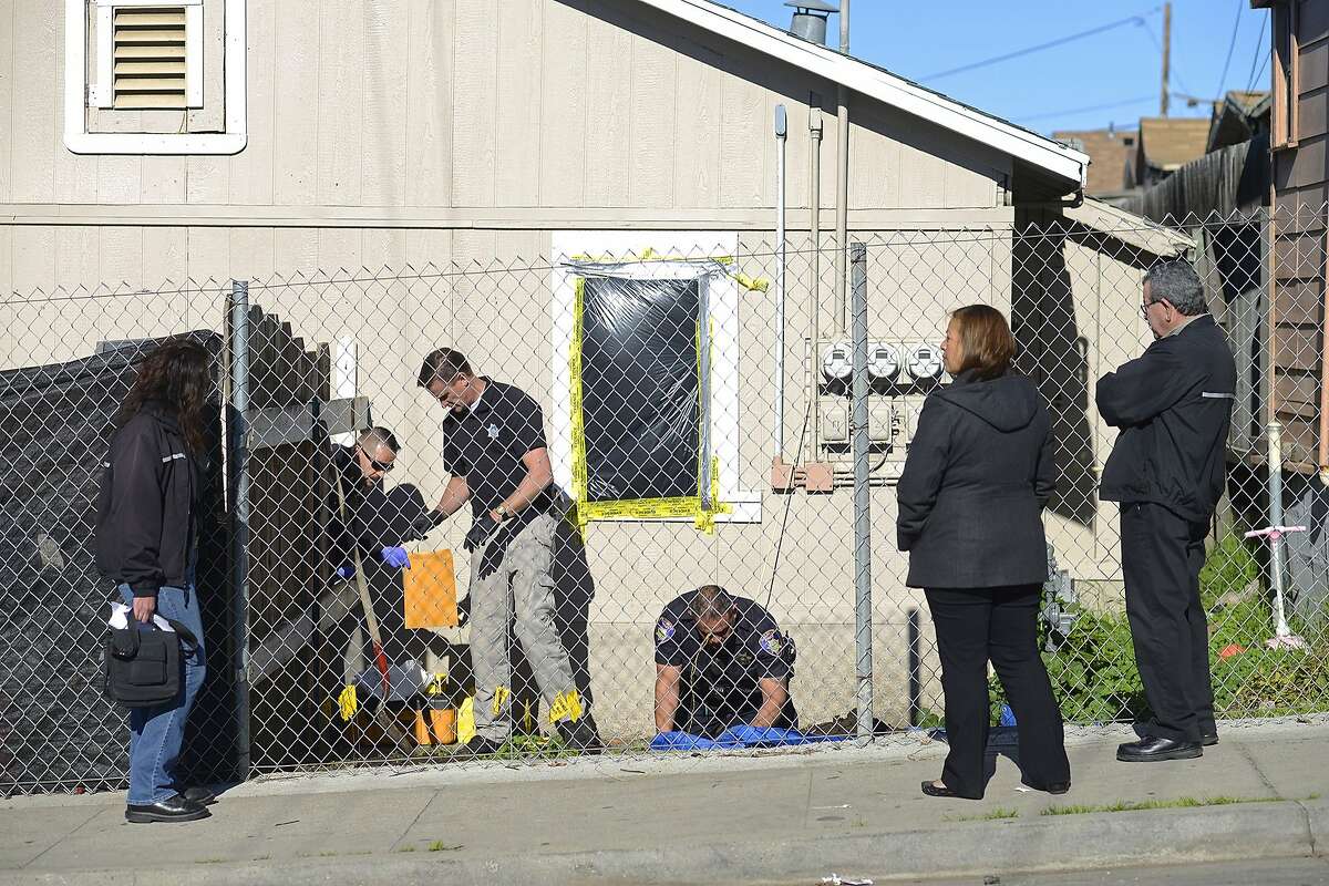 Code of Enforcement Officers observe an excavation conducted by Salinas Police Officers at Tami Joy Huntsman's backyard in Salinas, Calif., on Dec. 16, 2015. Huntsman, 39, and her 17-year-old boyfriend, Gonzalo Curiel, are under arrest in connection with a case in which an abused, starved 9-year-old girl was found in East Quincy and, later, the bodies of two young children being found in a Redding storage unit.