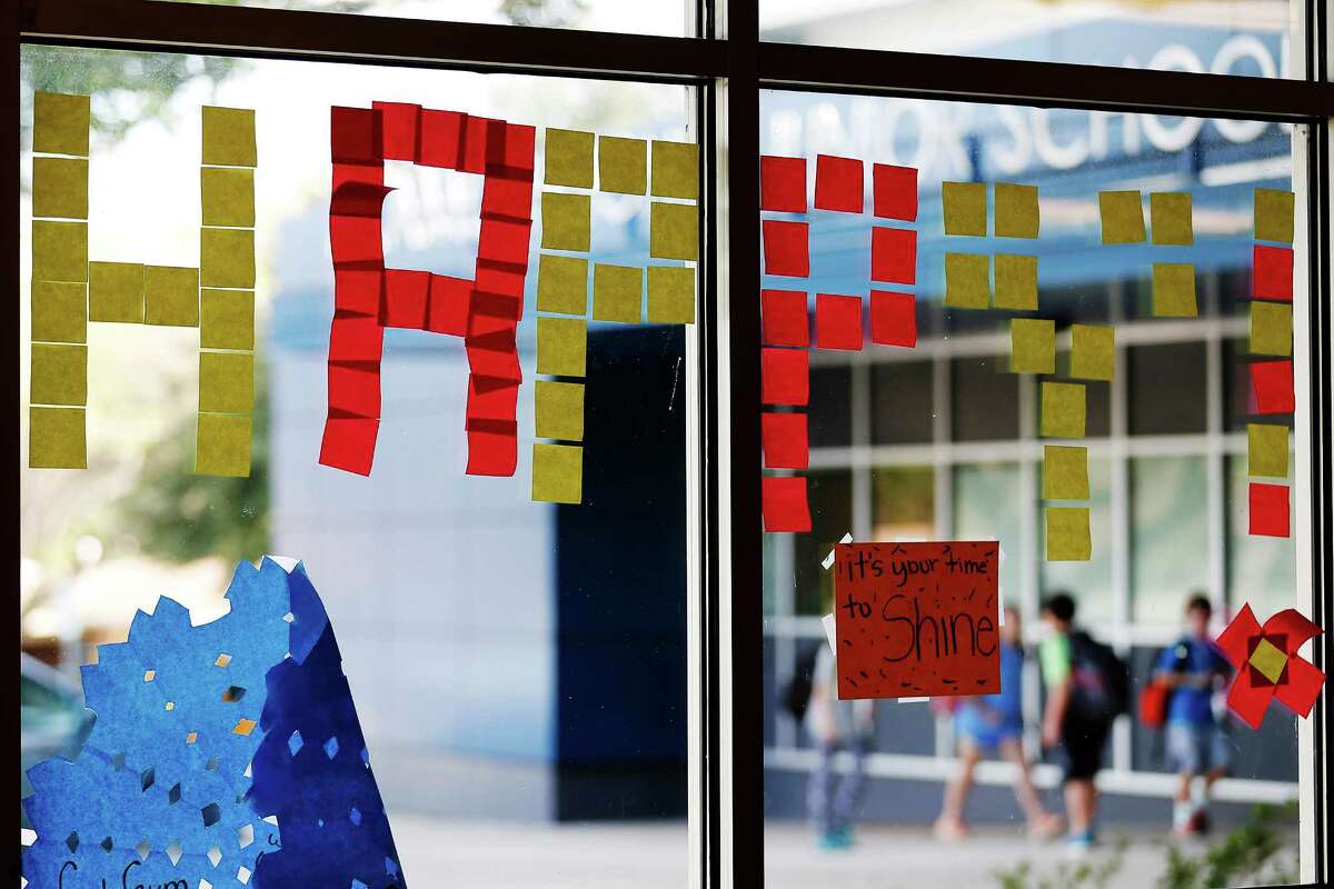 A positive note is displayed in the cafeteria at Alamo Heights Junior School on Tuesday, Dec. 15, 2015. Students at Alamo Heights Junior School participated in the school's "kindness week" which ended last Friday but decided on their own accord to continue the positive gesture by posting inspirational notes and posters throughout the school. Students and families also take part in "Angel donations" for economically disadvantaged students by furnishing essential personal care items, grocery items and also a gift from a wish list. About 65 students from 44 families benefitted from the donations at the junior school according to the school's wellness counselor Lisa Lucas. (Kin Man Hui/San Antonio Express-News)