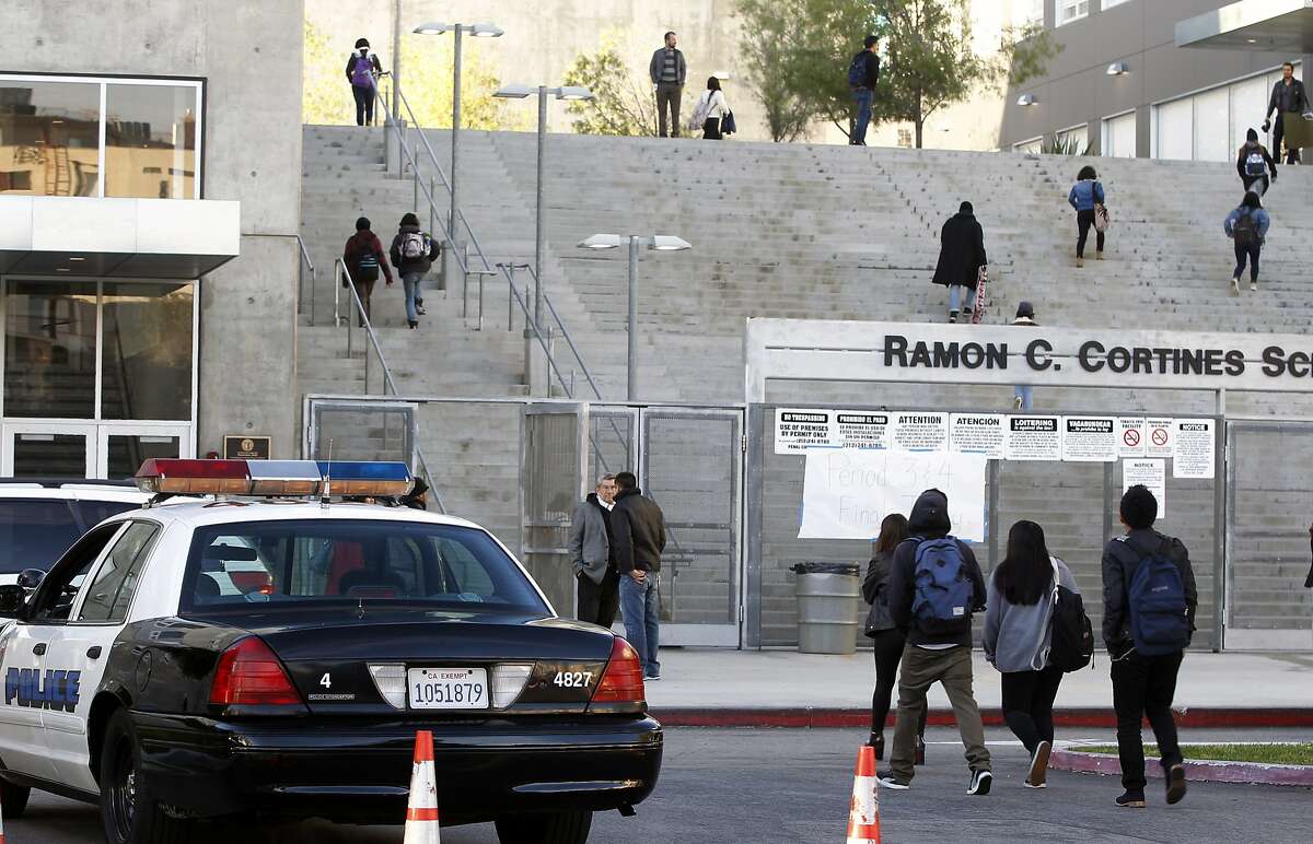 FILE — Students arrive at the Ramon C. Cortines School of Visual and Performing Arts in downtown Los Angeles on Wednesday, Dec. 16, 2015. Students are heading back to class a day after an emailed threat triggered a shutdown of the vast Los Angeles Unified School District.