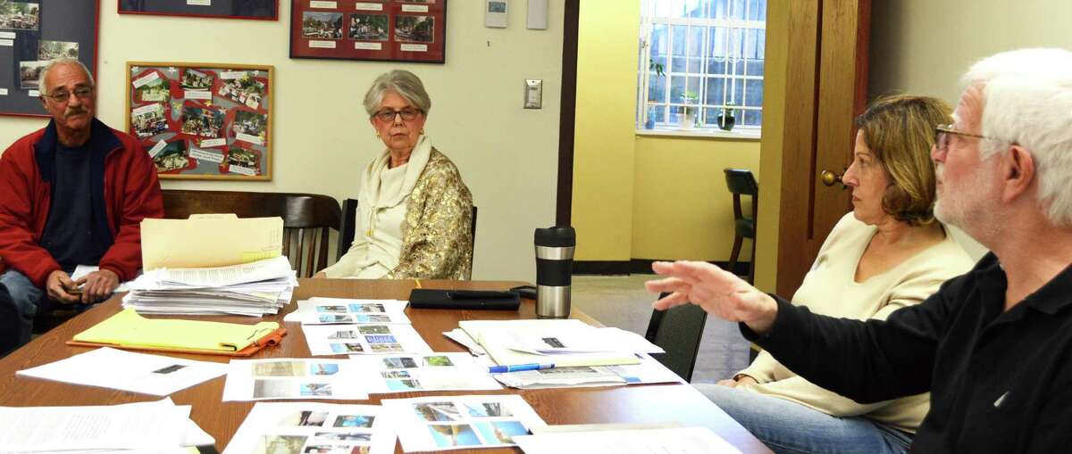 Dick Stein, far left, told the Representative Town Meeting subcommittee studying a possible historic landmark designation for the Saugatuck swing bridge, that instead of preserving the bridge it should be replaced. Listening are, from left, Carol Leahy, the Historic District Commission administrator; Janet Rubel, a subcommittee member, and Bob Weingarten, the group's chairman.