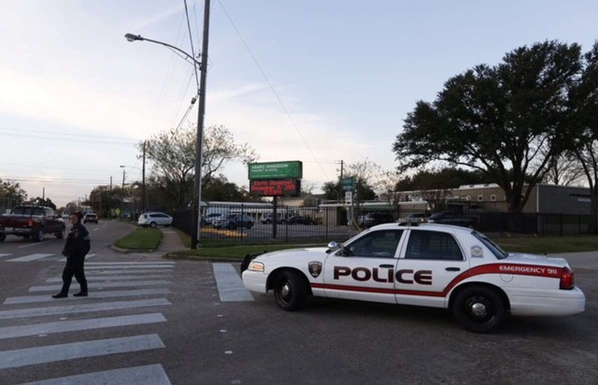 At the Arabic Immersion School in north Houston, a police car blocked one entrance, and an officer patrolled the sidewalk on the other side of the campus in the wake of terror threats across the country. Dec. 17, 2015