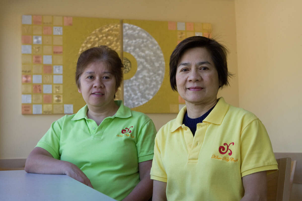 Kay Soodjai, in green, and Supatra Yooto, in yellow, have operated a Thai restaurant in Montrose for nearly 30 years. Its current incarnation is Khun Kay Thai Cafe; previously it was The Golden Room. The sisters in law have sold the restaurant to new owners who are assuming the business Jan. 1, 2016.