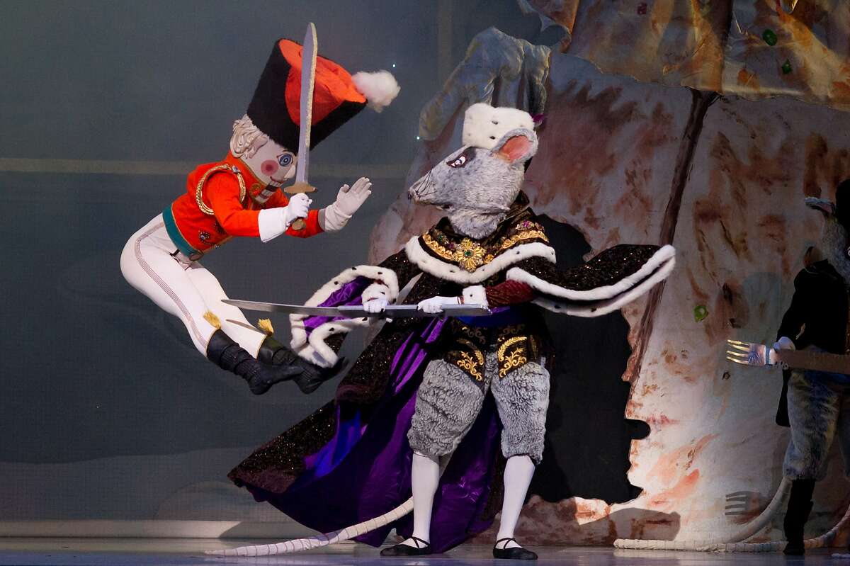 CAPTION: The Nutcracker (Gregory De Santis) and the Rat King (Jahmal Chase) in the Oakland Ballet's production of Graham Lustig's "Nutcracker" at the Paramount Theatre through Sunday Dec. 20/ Photo by David De Silva