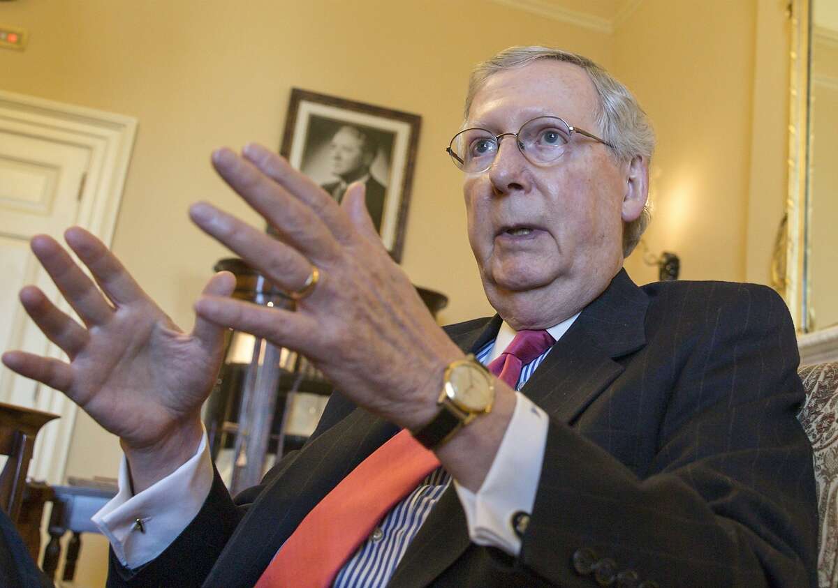 Senate Majority Leader Mitch McConnell of Ky. gestures during an interview with The Associated Press, Wednesday, Dec. 16, 2015, in his office on Capitol Hill in Washington. McConnell talked about the work to complete a compromise package that would fund the government through the 2016 budget year. McConnell also talked about the realities of divided government, working with new House Speaker Paul Ryan and his relationship with long-time Democratic nemesis Sen. Harry Reid of Nevada. (AP Photo/J. Scott Applewhite)