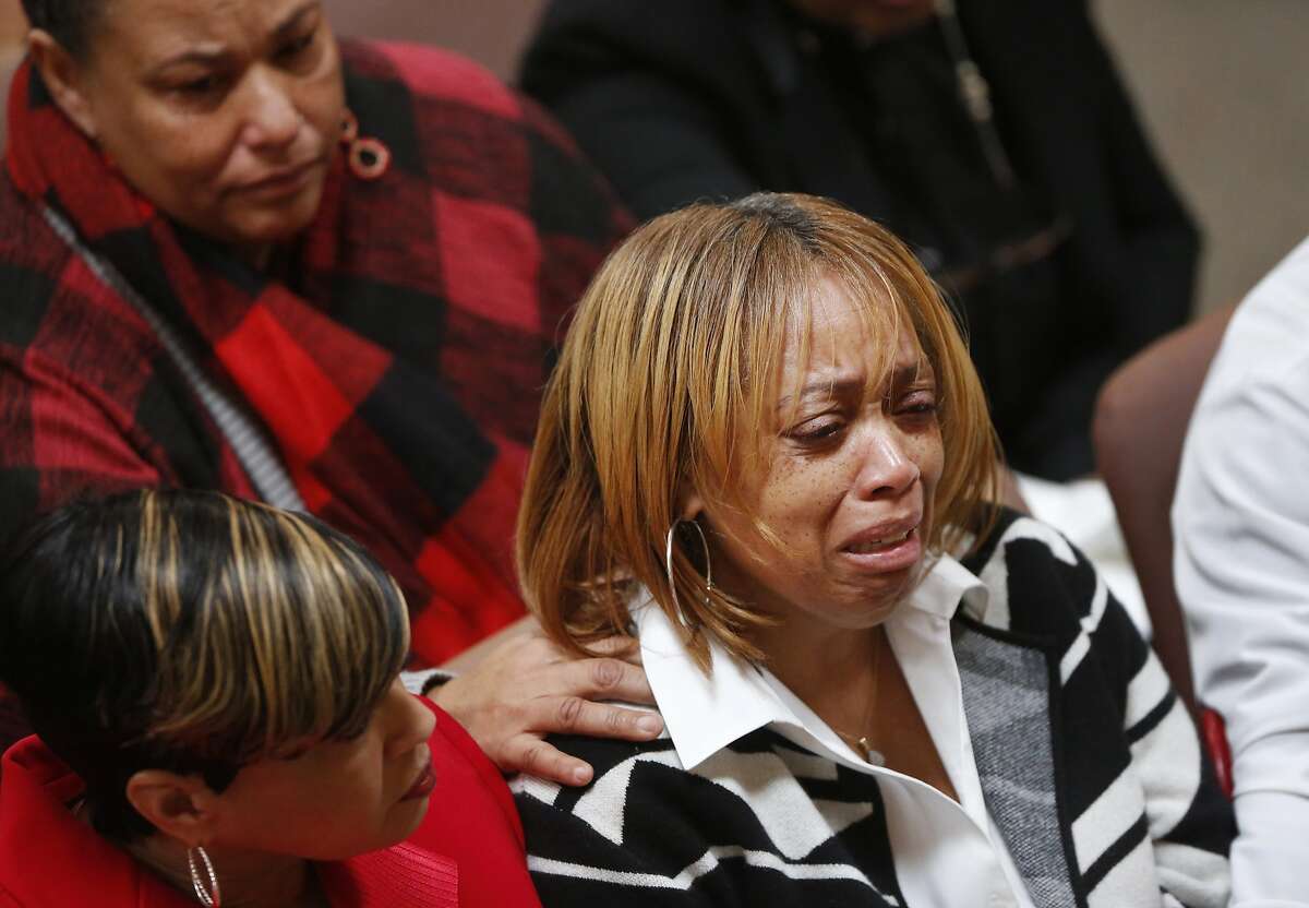 Gwen Woods is comforted as she mourns her late son Mario Woods during his funeral service at Cornerstone Missionary Baptist Church Dec. 17, 2015 in San Francisco, Calif. Mario Woods was fatally shot by San Francisco police in early December.