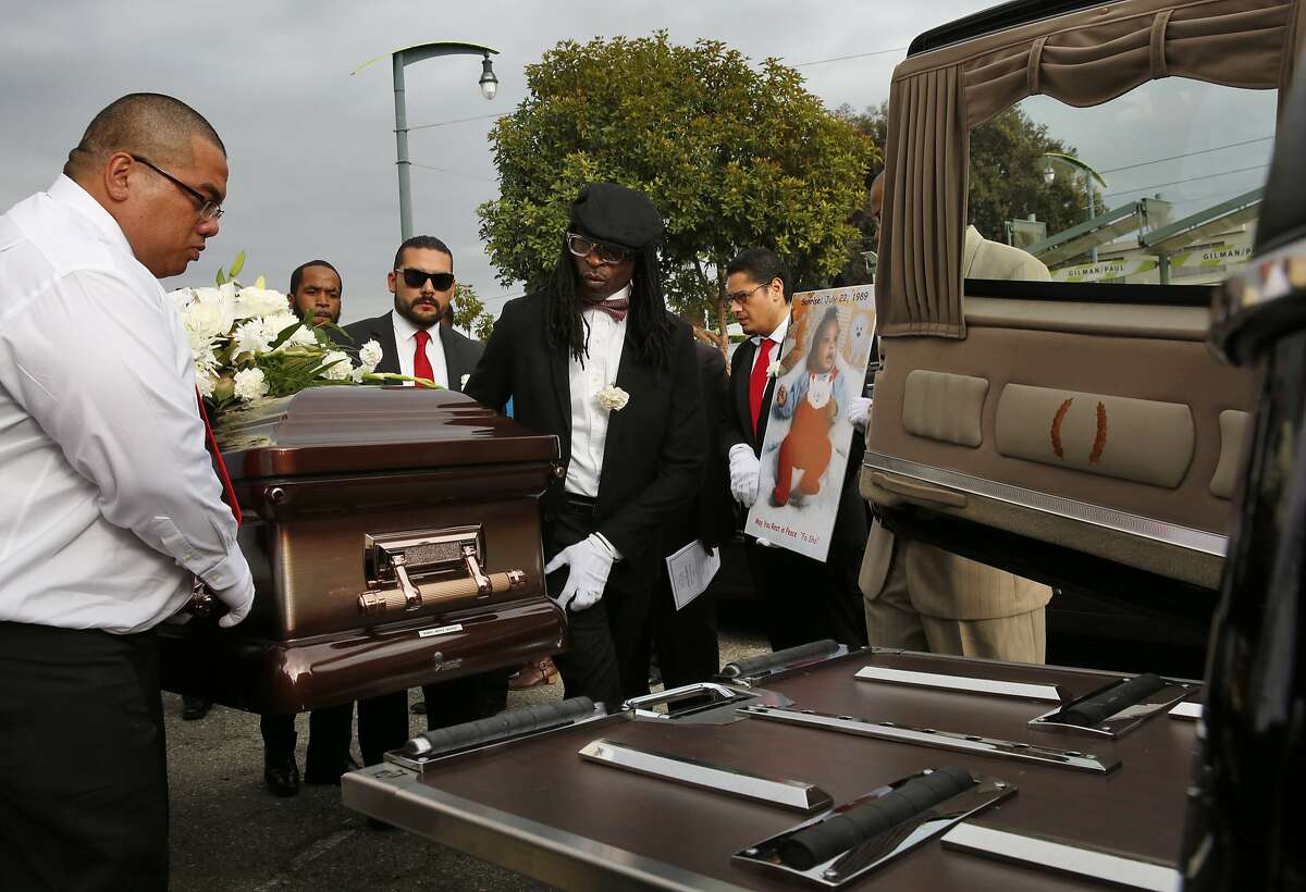 Pallbearers load the coffin of Mario Woods into a hearse after the funeral service for Woods at Cornerstone Missionary Baptist Church Dec. 17, 2015 in San Francisco, Calif. Mario Woods was fatally shot by San Francisco police in early December.