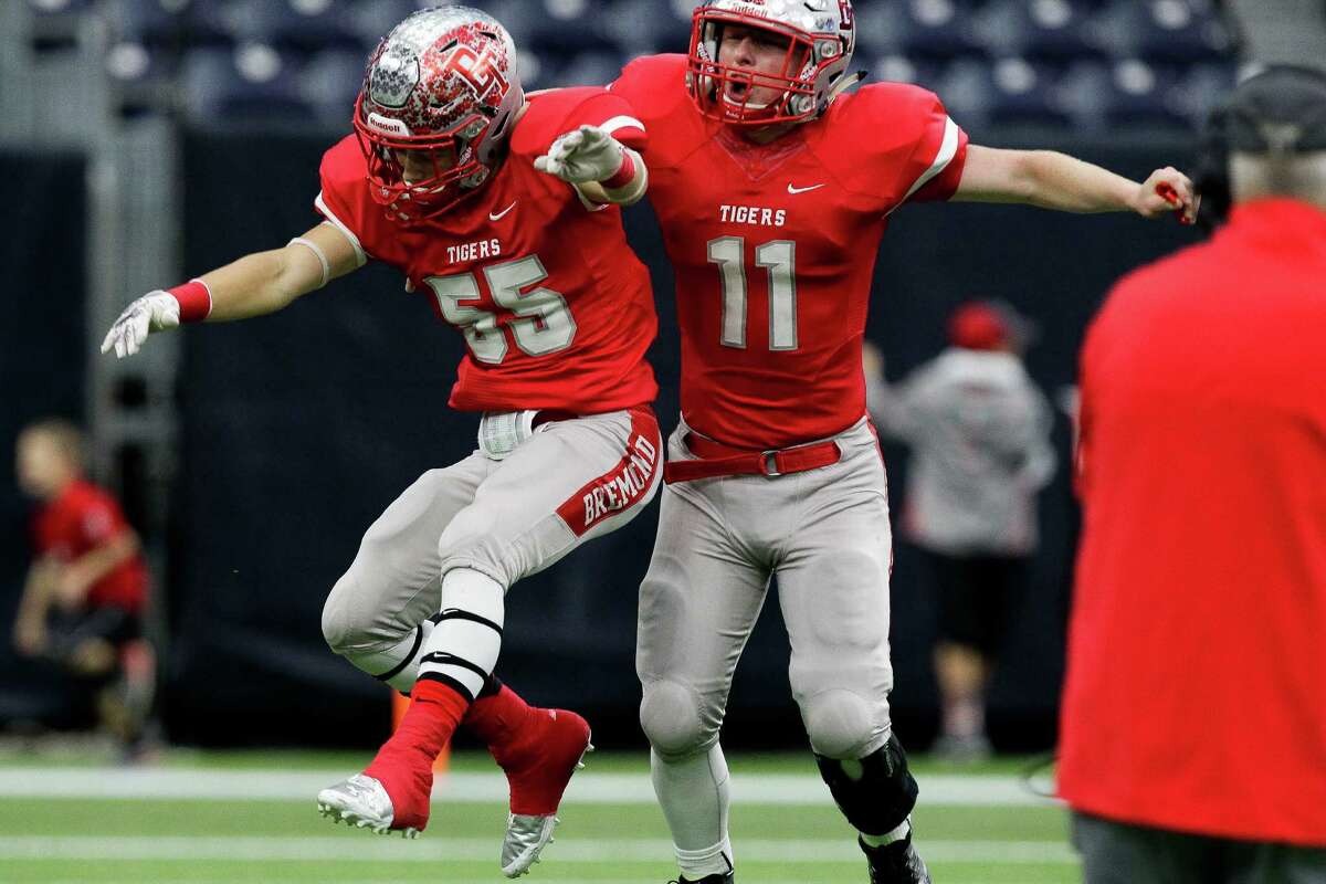 Bremond Tigers linebacker Eric Wilganowski, left, and wide receiver Andrey Jones celebrate after a touchdown during the 2A Division II football state championships at NRG Stadium Thursday, Dec. 17, 2015, in Houston. Bremond beat Albany 35-20 to win the championship for the second year in a row.